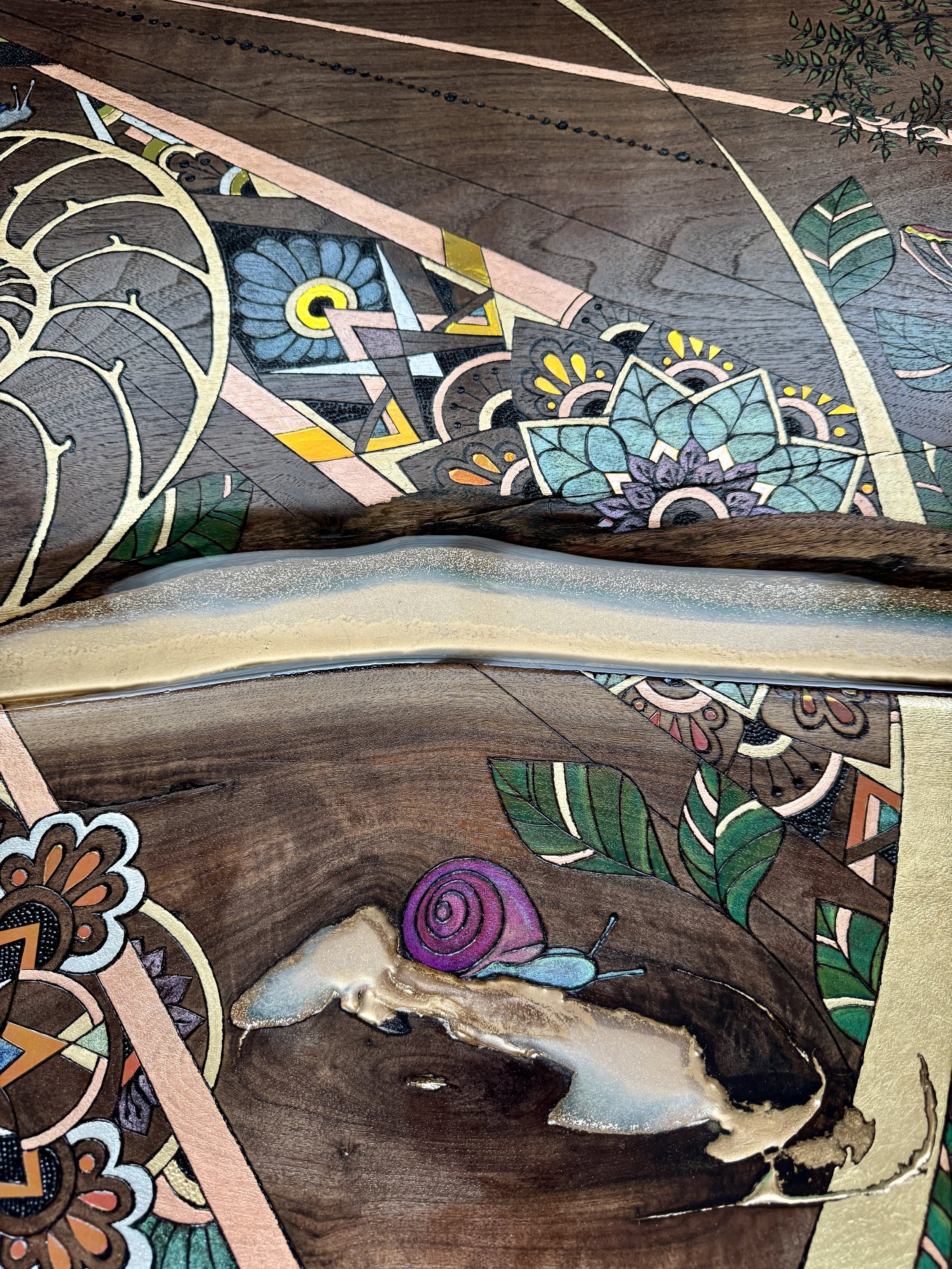 Mixed media wall art combining wood burning, resin, and botanical imagery