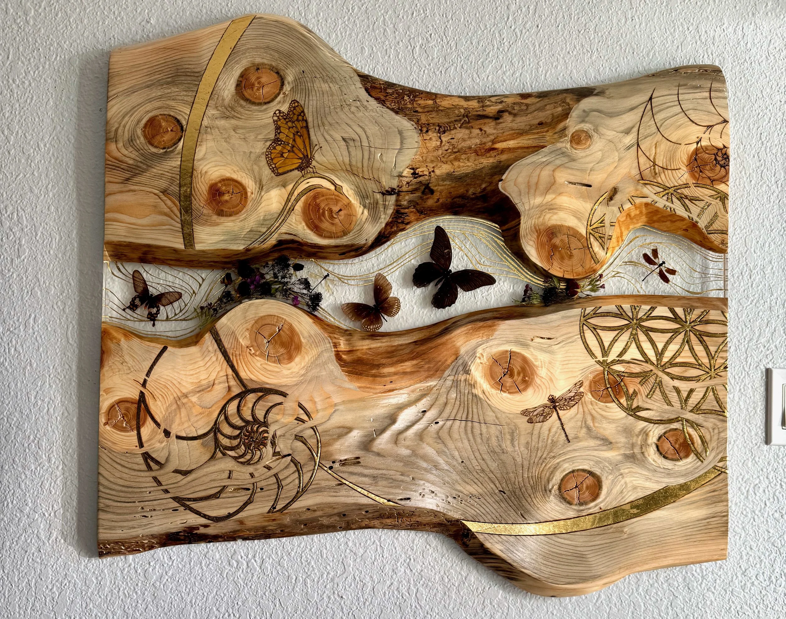 Lovers Carvings wall art by Anne Shackelford, aspen wood with resin, butterflies, and dragonflies.