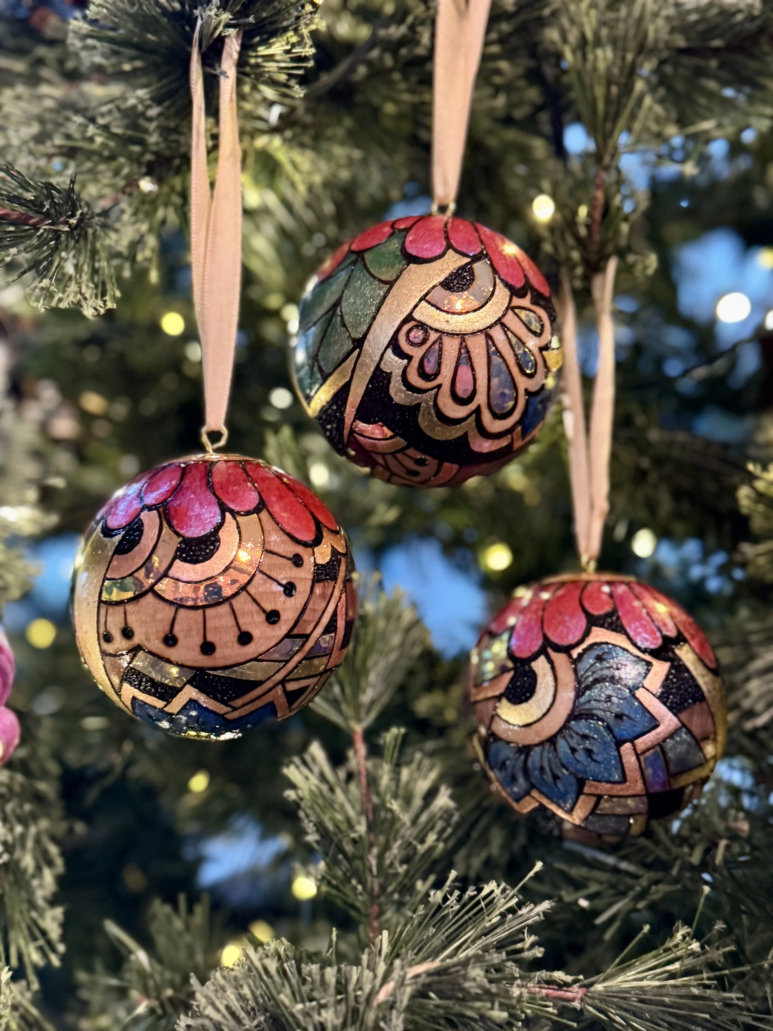 Reflective Firelight Orb, nature-inspired wood sphere layered with gilding, pigment, and holographic light.