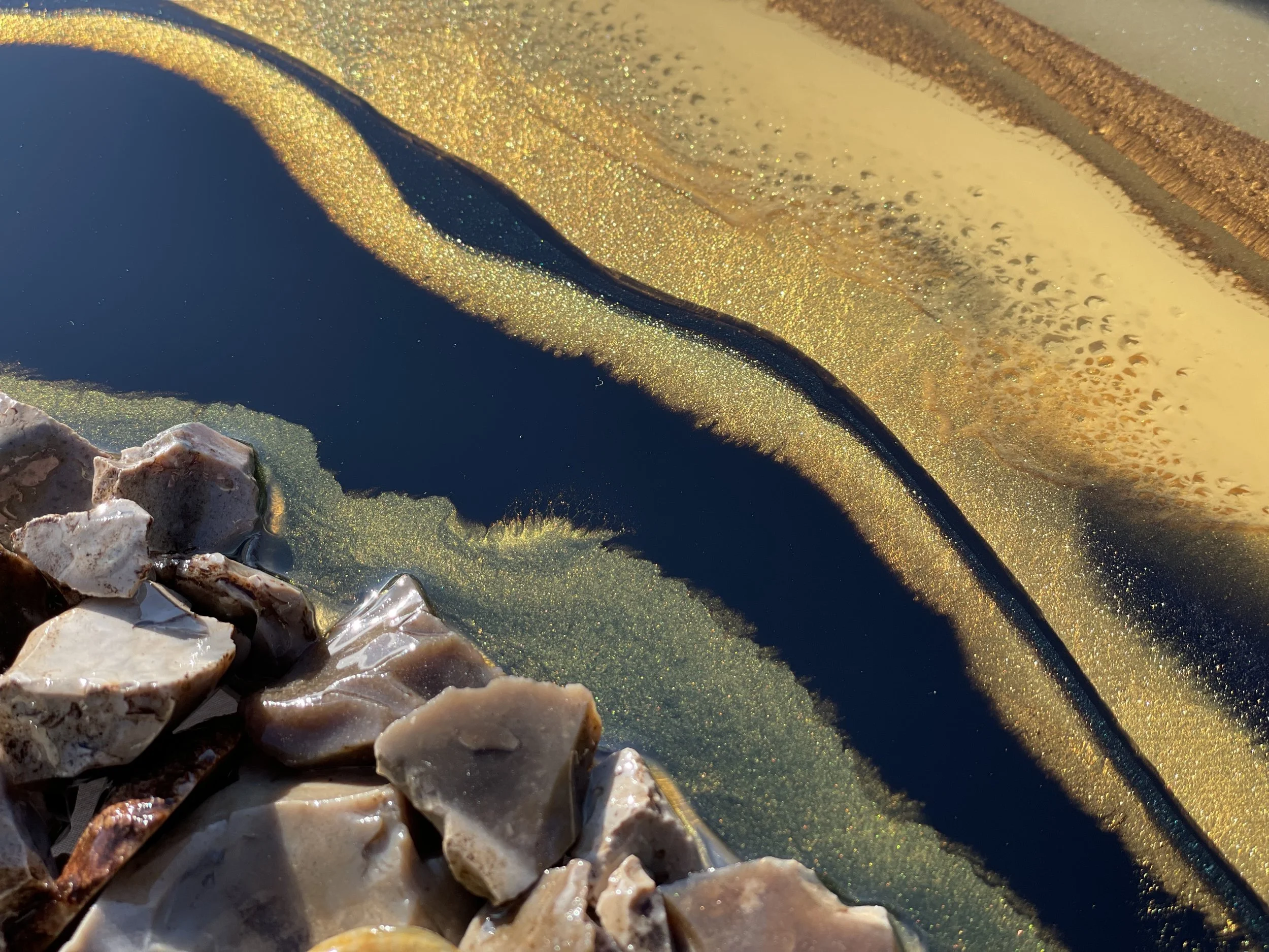 Mixed media wall art with natural stone, shells, and resin