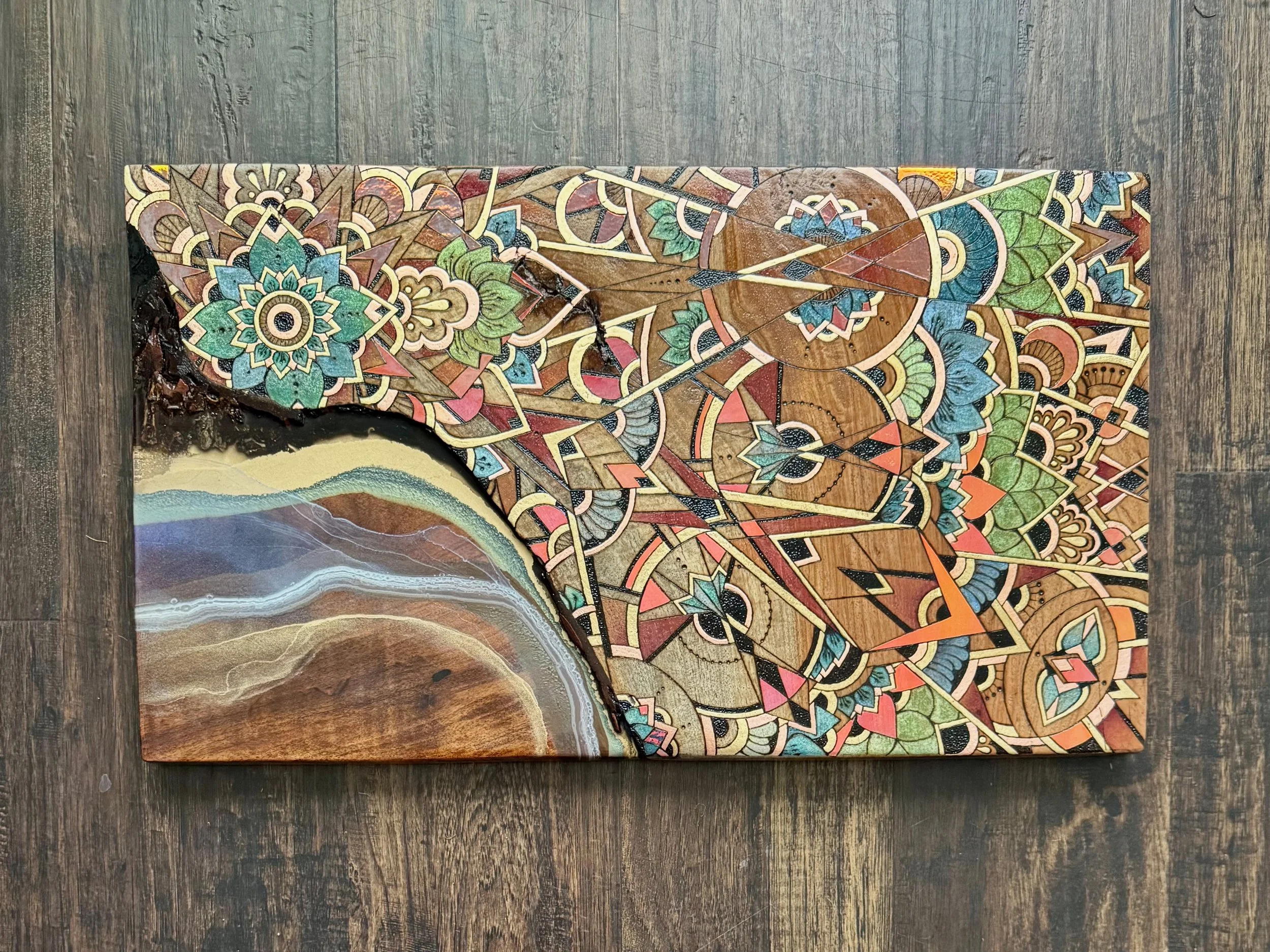 Woodburned mandala on walnut with resin river and mesquite inlay, sacred geometry art made in Austin Texas.
