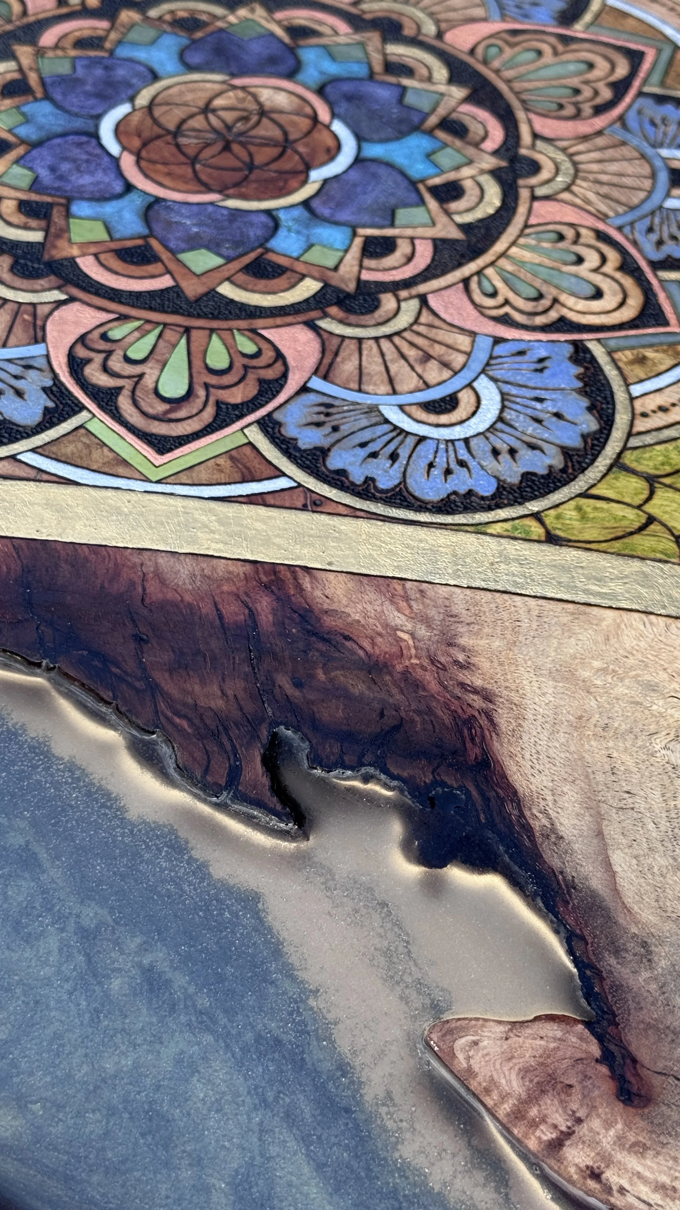 Detail of Alchemy of Becoming showing pyrography, pigment, and layered mixed media textures by Anne Shackelford.
