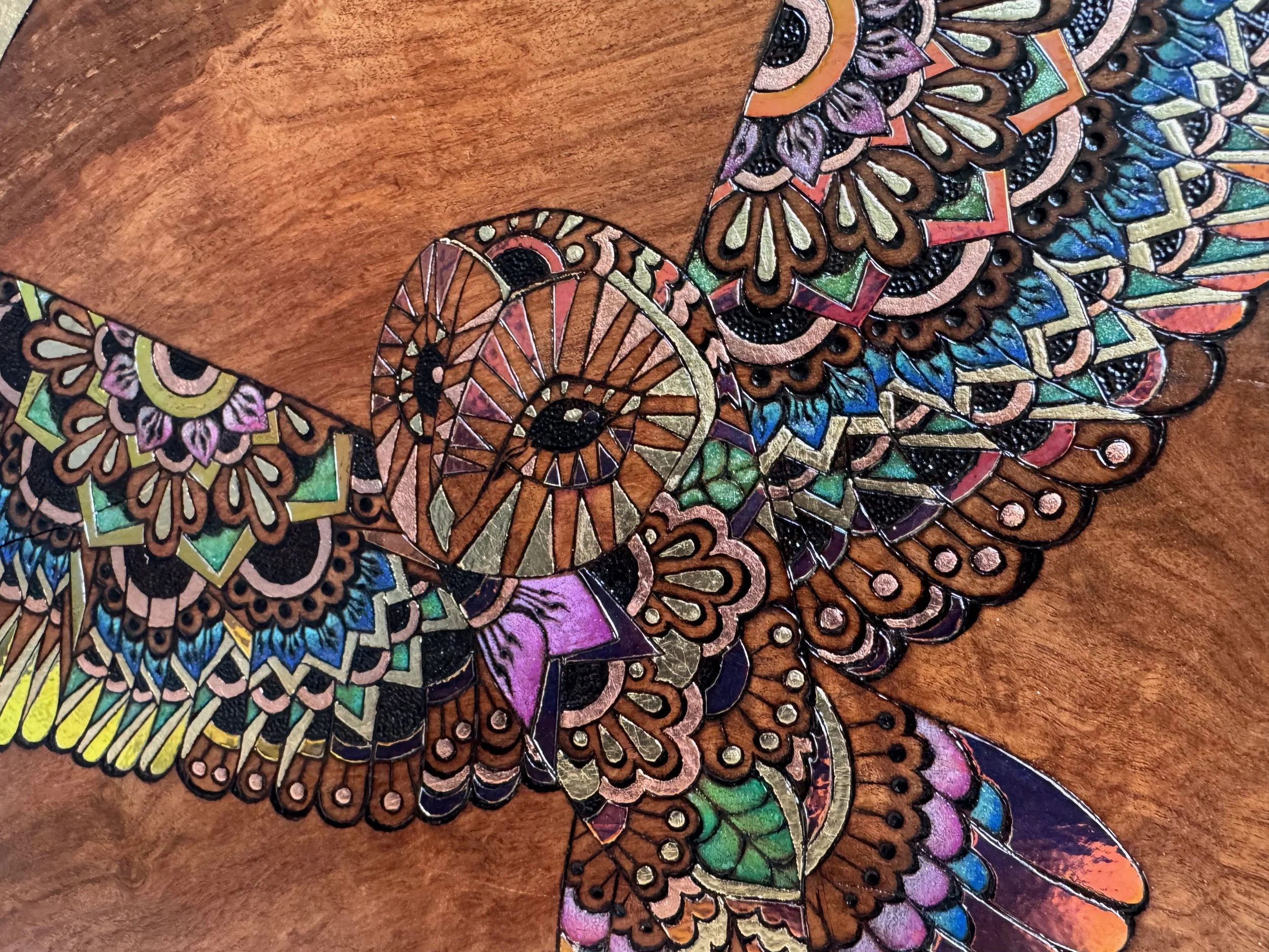 Hand-burned wood artwork Emberwing by Anne Shackelford, gilded details and luminous finish.