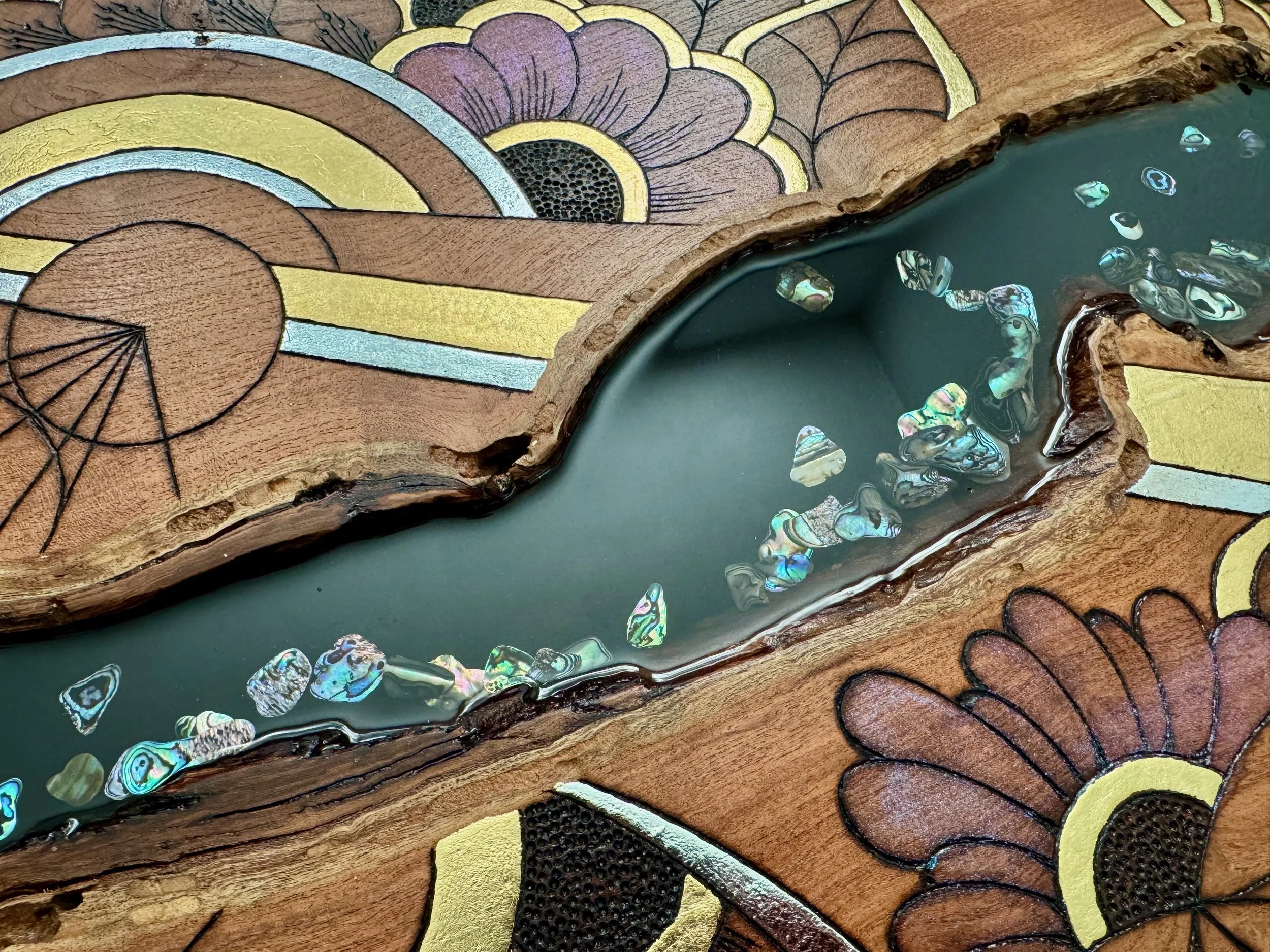 Mixed media wall art Metamorphosis by Austin artist Anne Shackelford, resin and abalone shell.