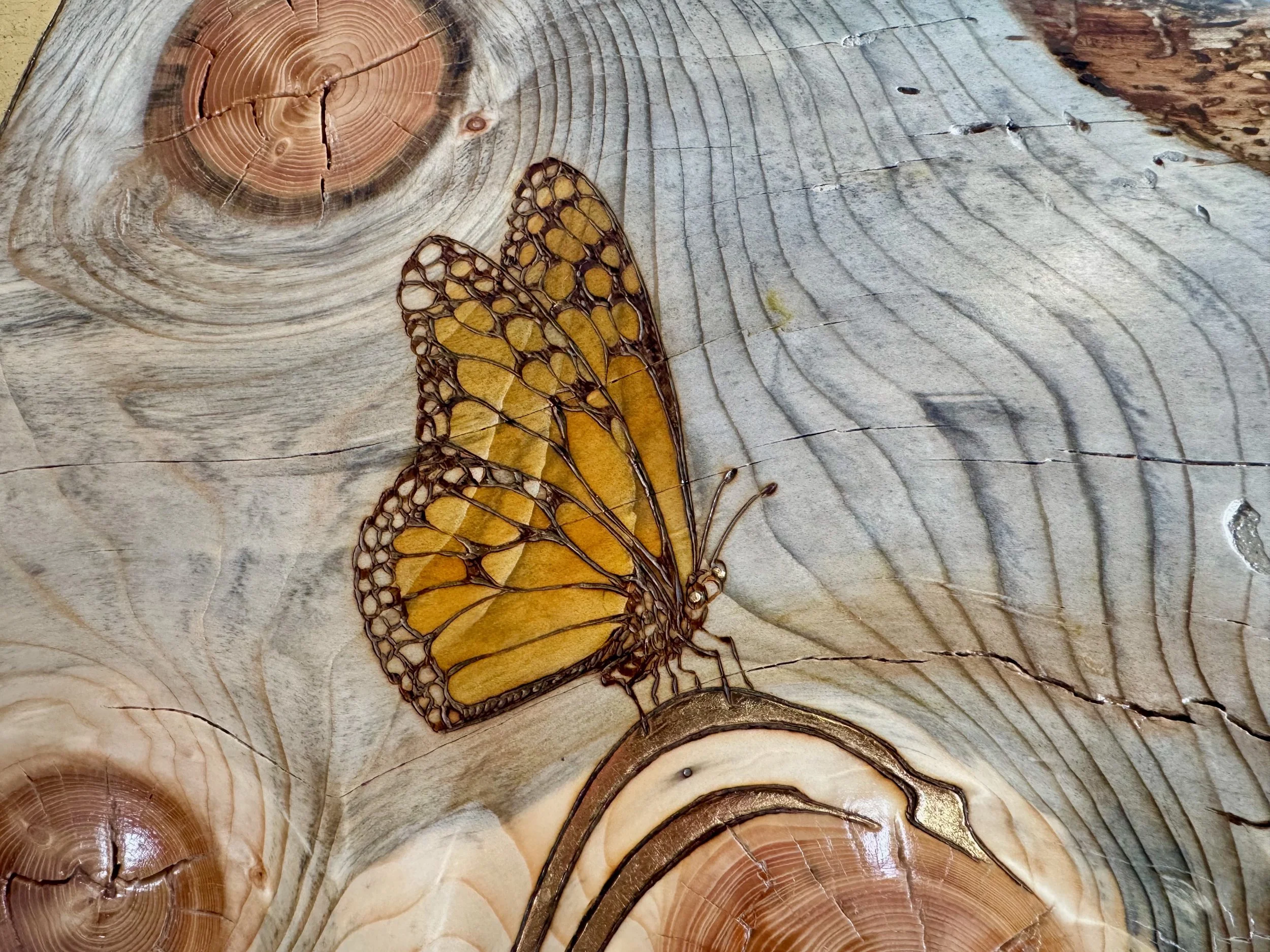 Gold leaf accents on hand-burned aspen wood, Lovers Carvings by Austin artist Anne Shackelford.