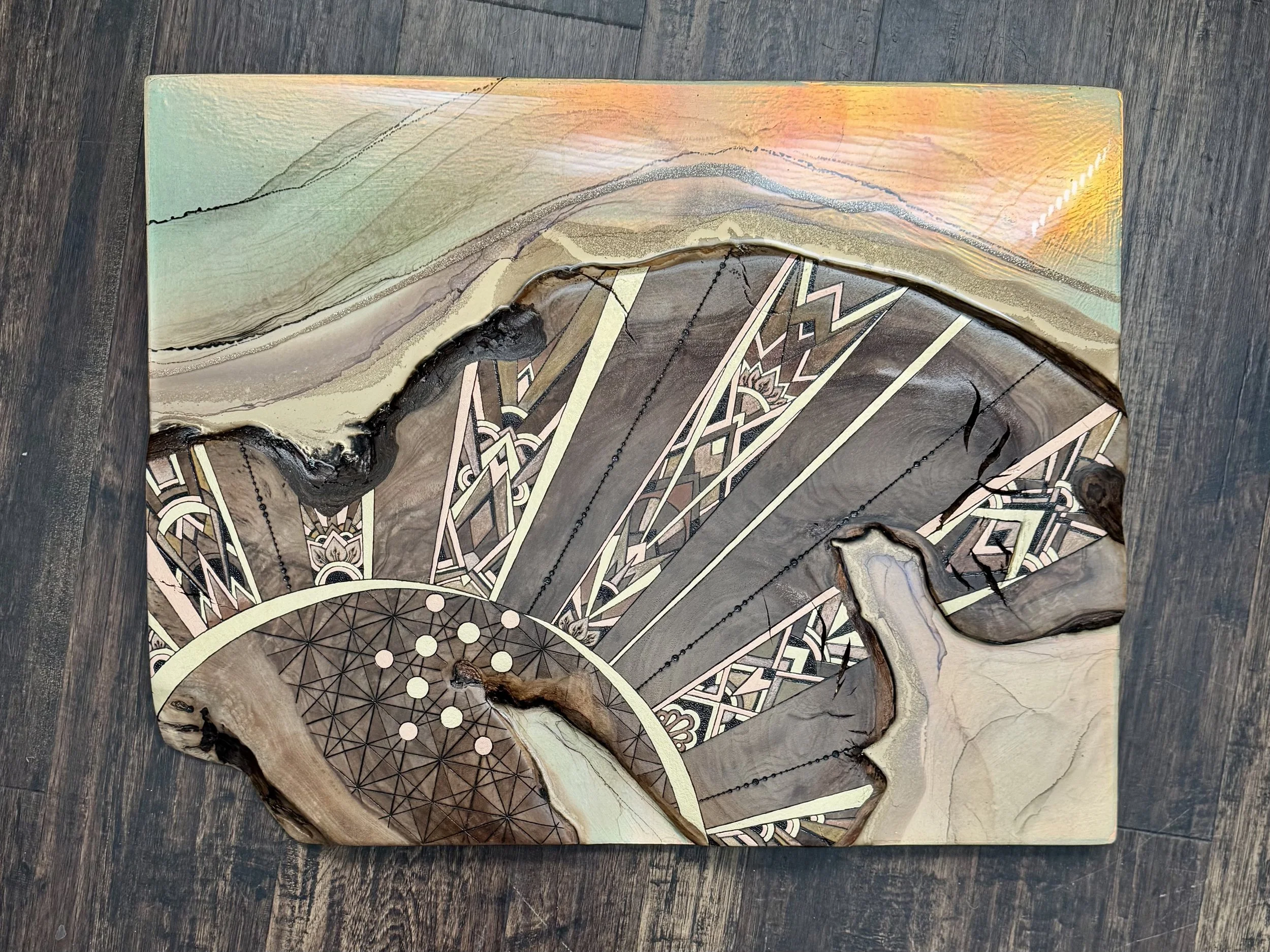 Radiant sun wall art created with resin and metallic detail