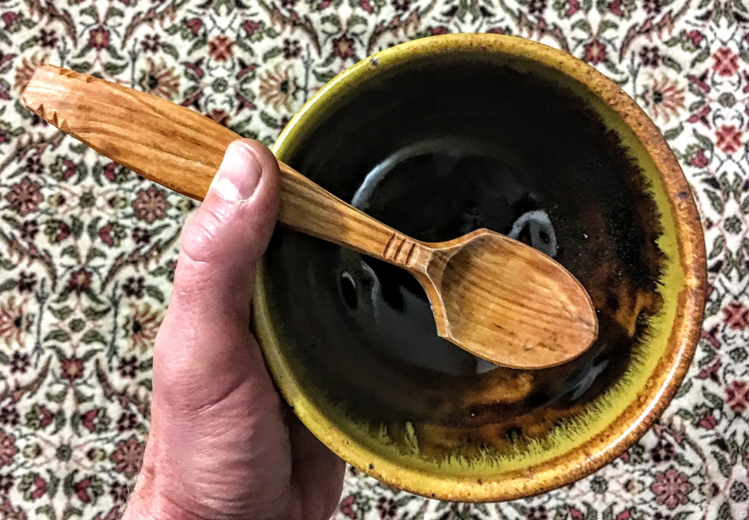 clay bowl, wood spoon.  