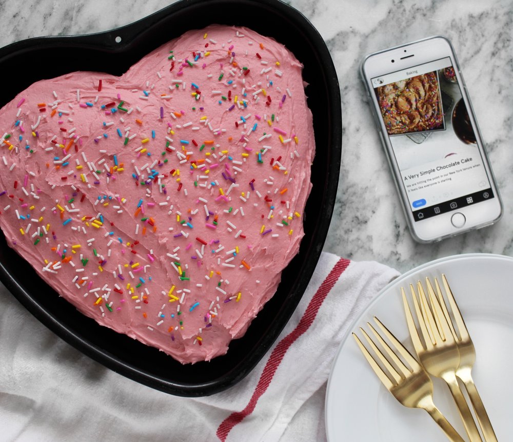 valentines-day-heart-shaped-chocolate-cake-with-pink-frosting-and-sprinkles.jpeg