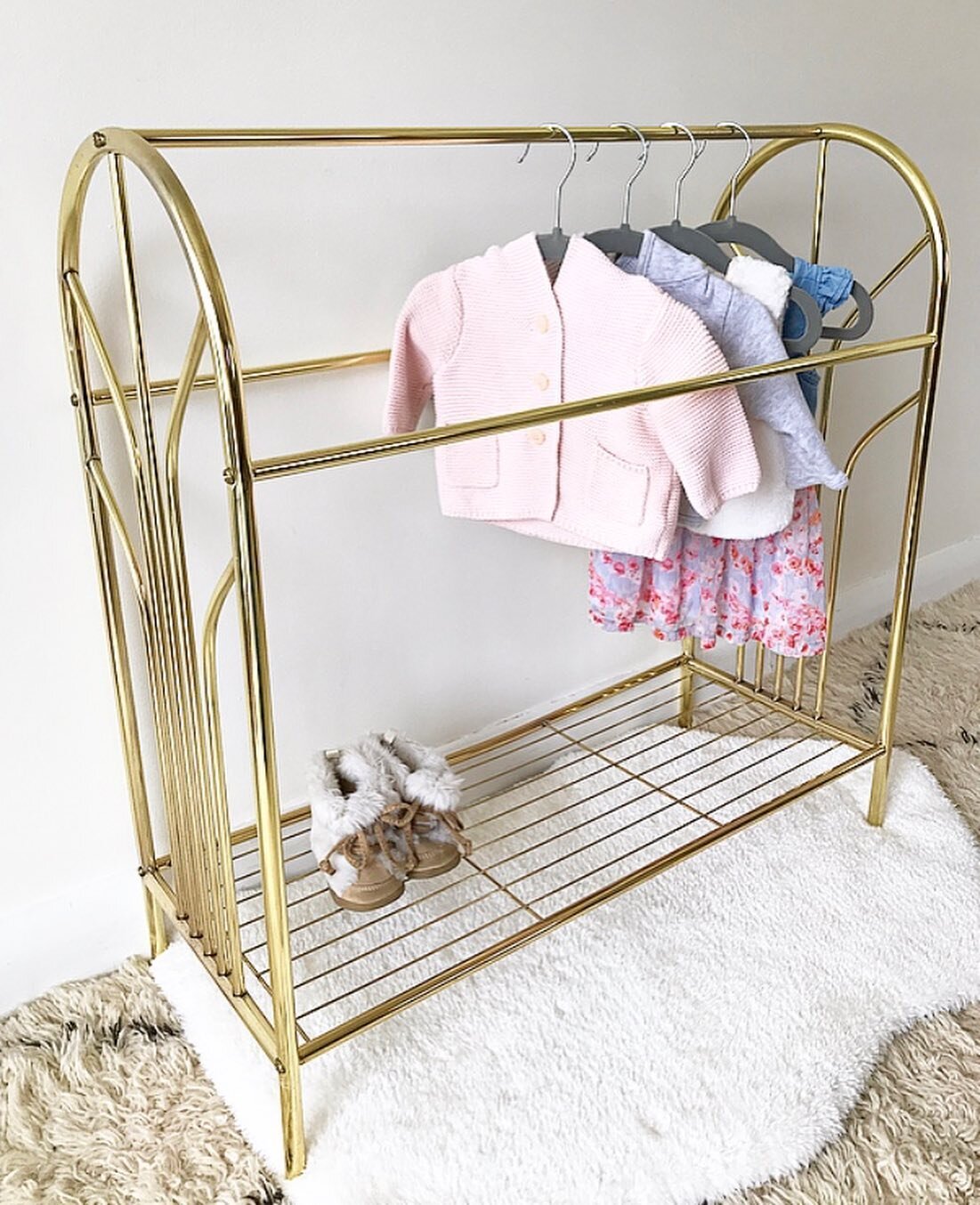 Baby Girl&rsquo;s wardrobe is starting to come together! She&rsquo;ll mostly be wearing earth tones and neutrals but we did pick out a few pink pieces for her. I sourced this brass towel/blanket rack for my vintage boutique (@foxphoenixvintage) and t