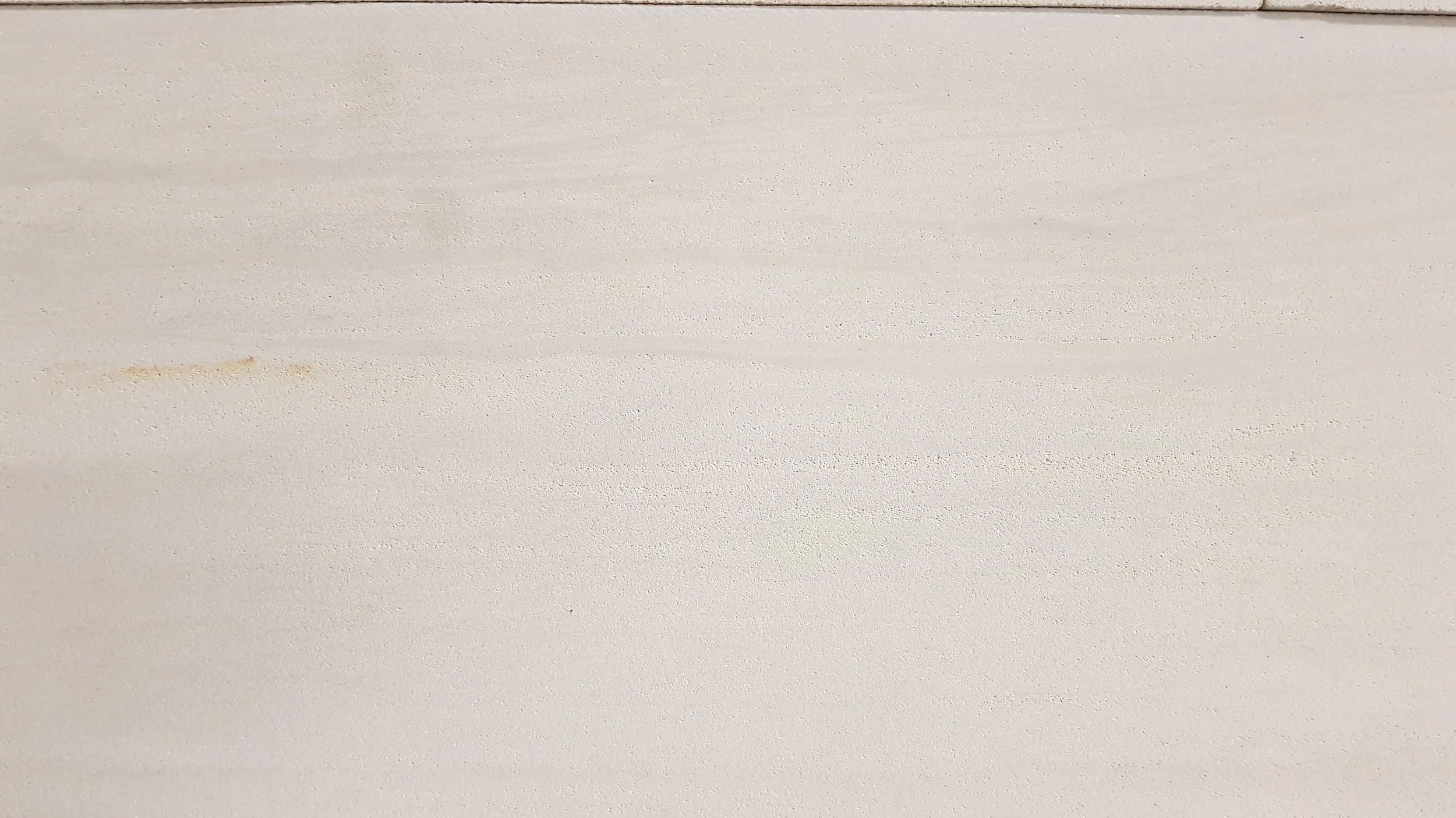 SILTSTONE HONED TEXTURE CLOSE UP. OUR STONE HAS BEAUTIFUL YET SUBTLE SEDIMENTARY LINES.