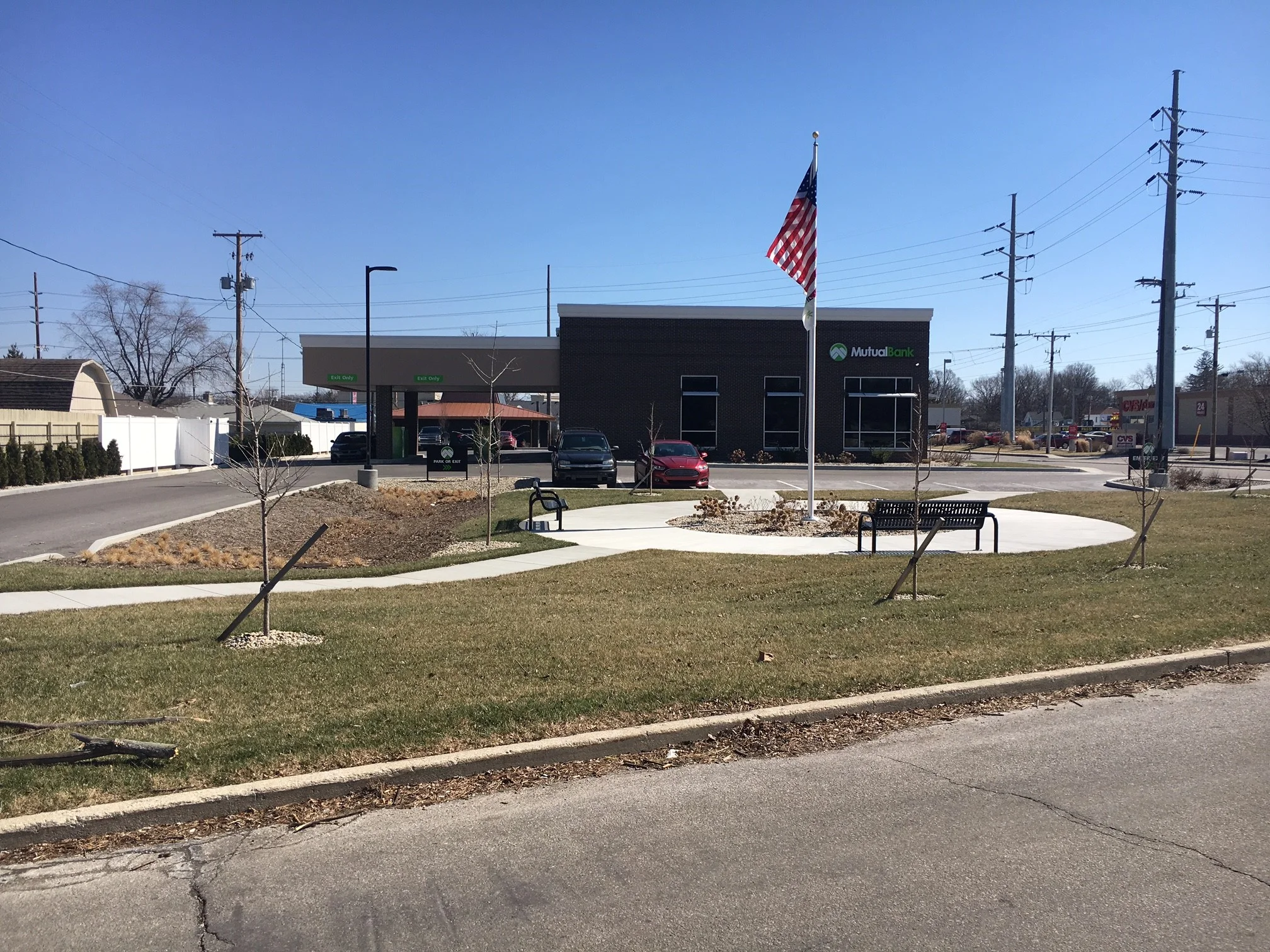 The Pond area on the left side of the image, is called a "Storm Water Planter" and has under ground perforated pipe that absorbs the water through the soil. This is done to fulfill Muncie's standards. 