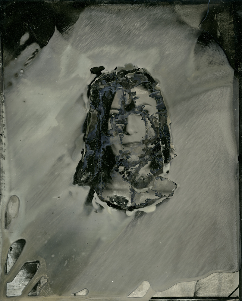 If the photograph steals your soul, wet plate collodion steals whatever is left. The process responds differently to light. It sees below the surface of your skin. It lifts the veil of mystery of the sitter. The process itself conventionally renders the subject in a seductive fashion. Ignoring this part of the process; I’ve focused on chance and mystery to help guide me. By altering my working process, I’ve begun to break the “rules.” These abstract portraits begin to re-steep the process in mystery. Lanae 9 5x8" x 7 11/16" wet plate collodion 2013