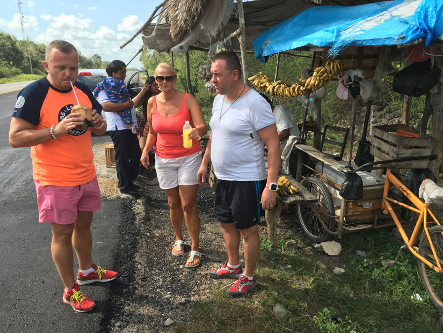 On the way to Chetumal, stopping by a village stall for fresh coconut water and pineapple juice