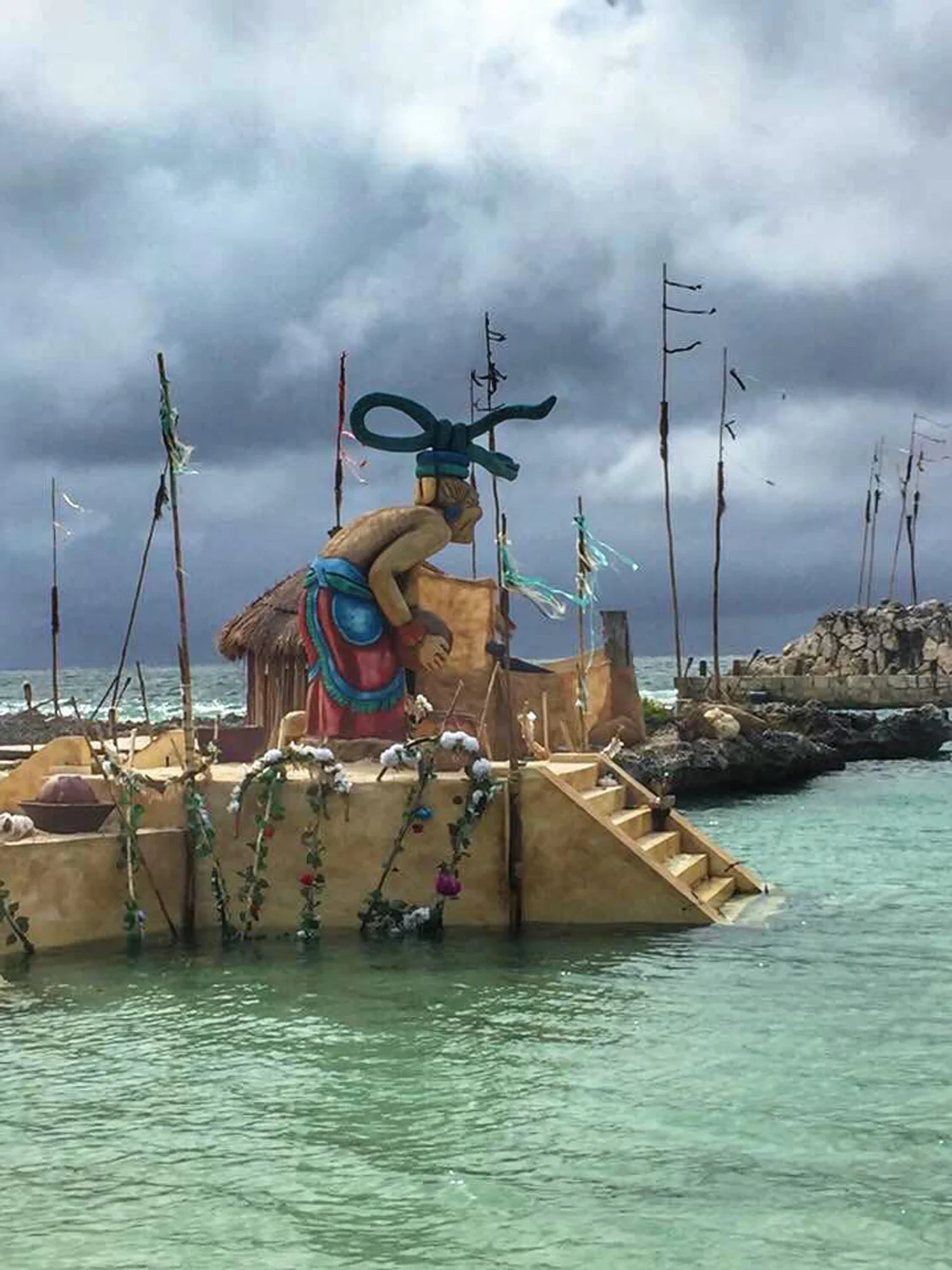 Godess Ix Chel statue at Xcaret ritual bay.