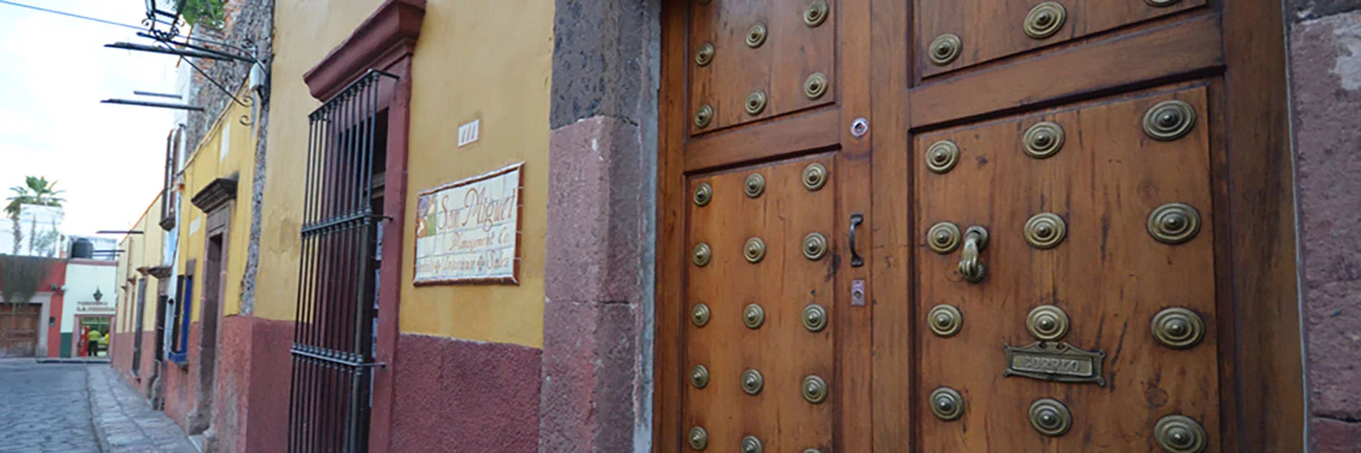 The indegenous people walk the city selling their artifacts.