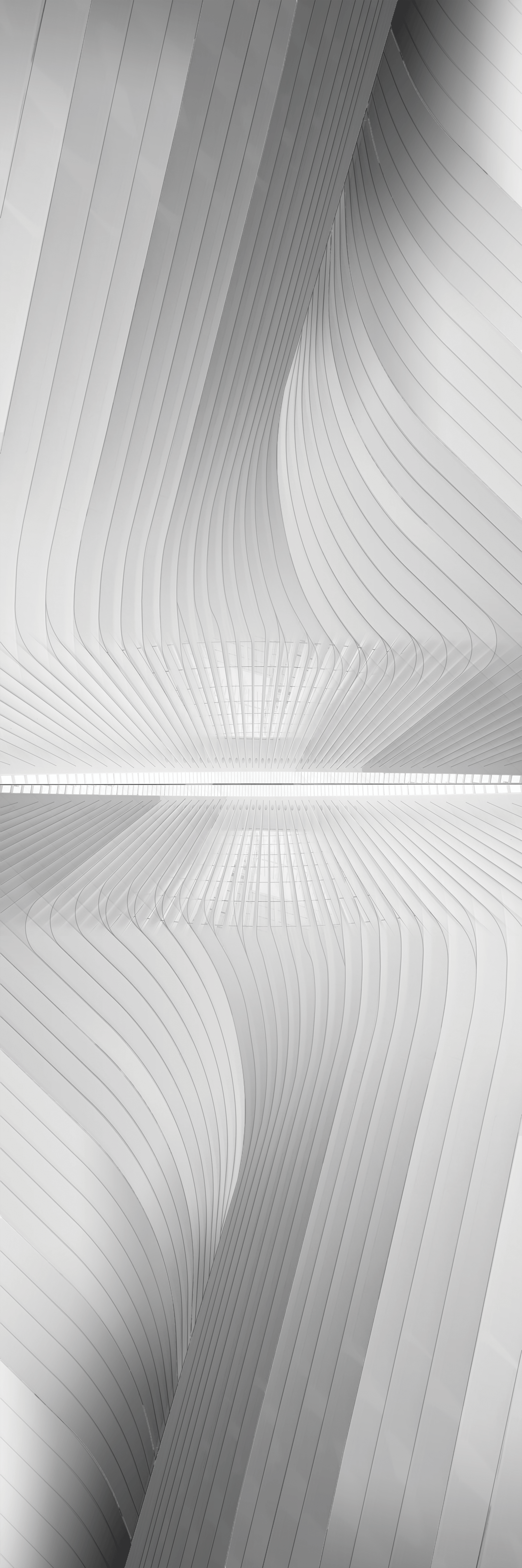 COLUMNS OF LIGHT Angela Garza World Trade Center Transportation Hub Santiago Calatrava The overall form of the World Trade Center Transportation Hub, termed The Oculus, was inspired by that of a dove being released from a child's hands, which symbolizes the new era of peace after the attacks this nation underwent on September 11, 2001. The major motif is light, and when the sun sets, the illuminated oculus then releases light back out to the surrounding neighborhood as a lantern. Light is such an important element, Calatrava speaks about the structure being supported by columns of light. The combination of natural light flowing throughout the entire station and its innate sculptural form brings relief to the mundane urban jungle of New York City. 