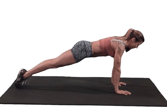 Correct pushup form (setup position): feet together with the shoulders, elbows, and wrists aligned and the butt and belly squeezed tight.