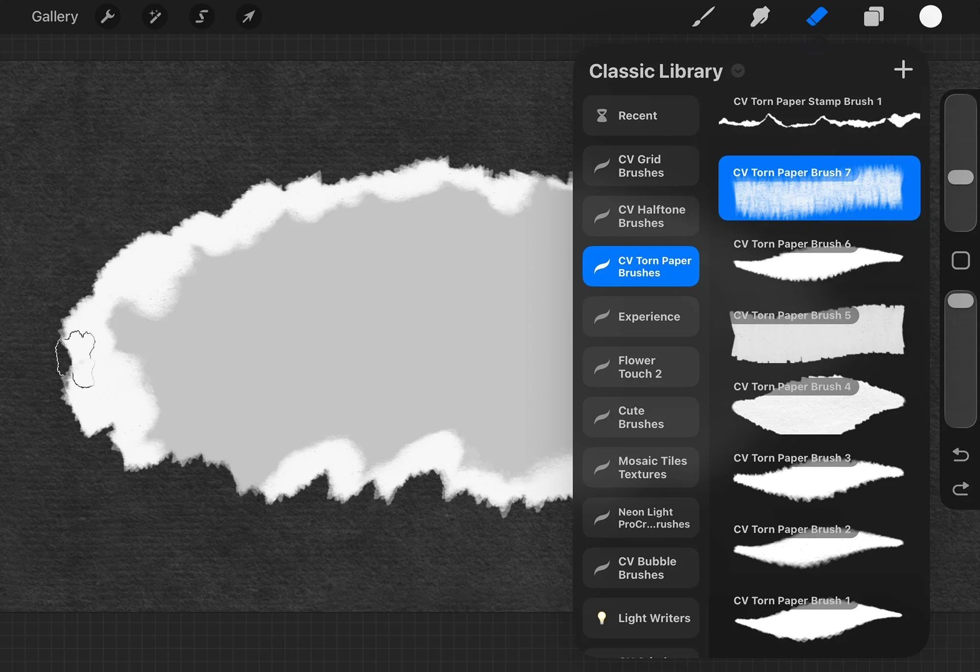 Erasing and overlapping stamps in Procreate to break the visible pattern repeat along the torn paper edge