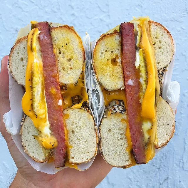Cage free fried egg, charred Taylor Pork Roll, american chz (house pickles and mustard if you were feeling crazi) on a hand-rolled everything. Was our last special of the summer, and we&rsquo;re missing it hard rn. Full time at le shop?