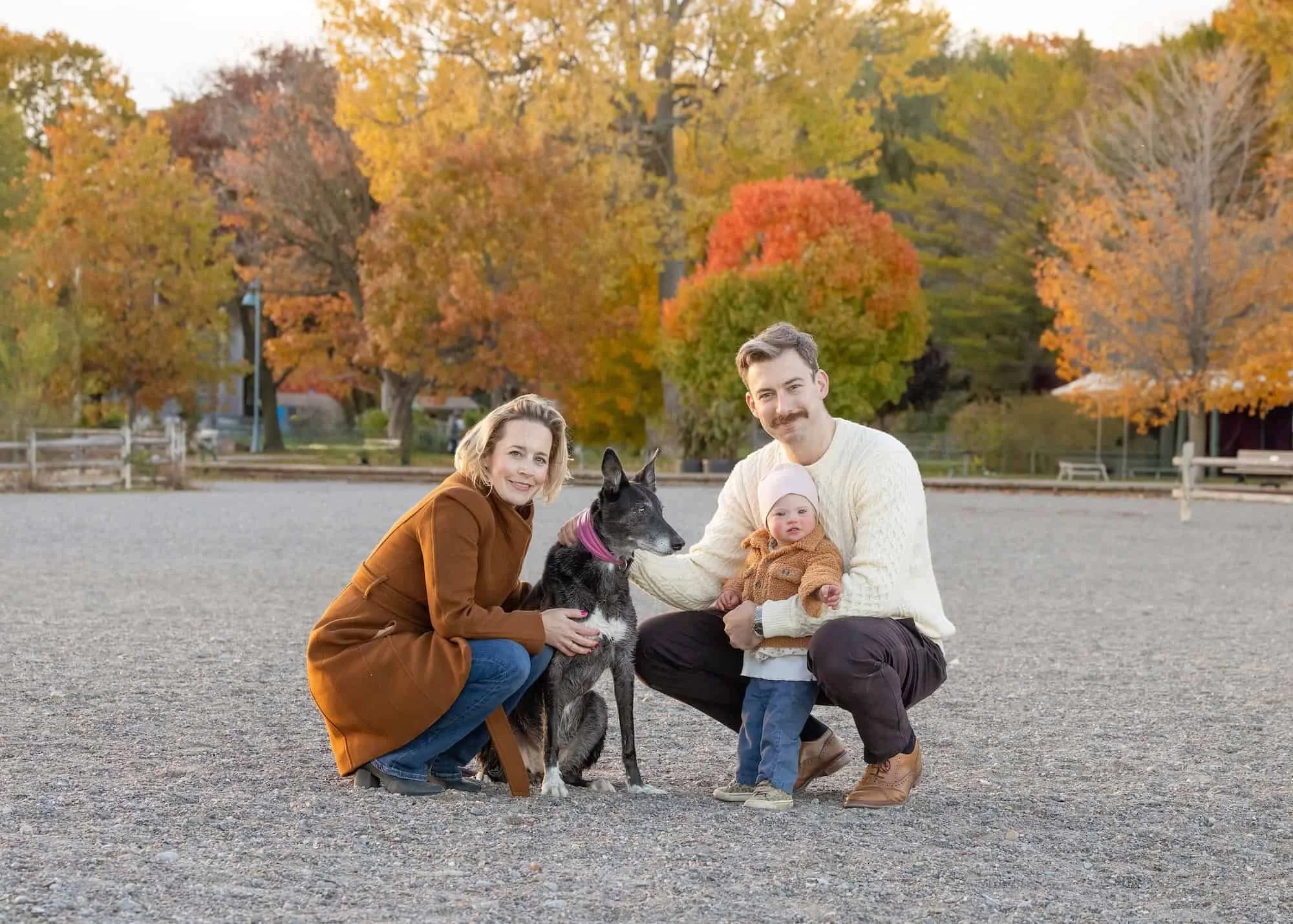 Family with their dog on a fall day at the beach, Toronto