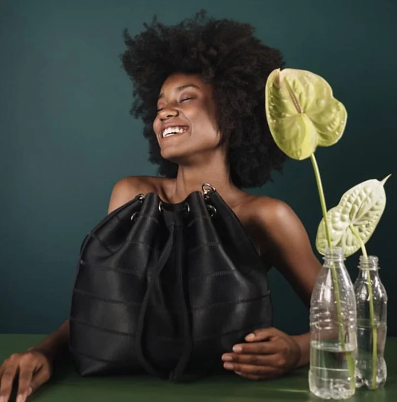 FROMBELO is the name and the JU BUCKET bag is made of old seatbelts! Nominated for Most Socially Responsible Handbag. All of their accessories are manufactured using fair labor &sustainable materials. This is their 2nd year being nominated!