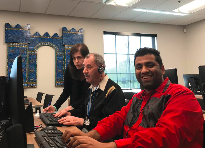 Clients at the foundation learning new programs.