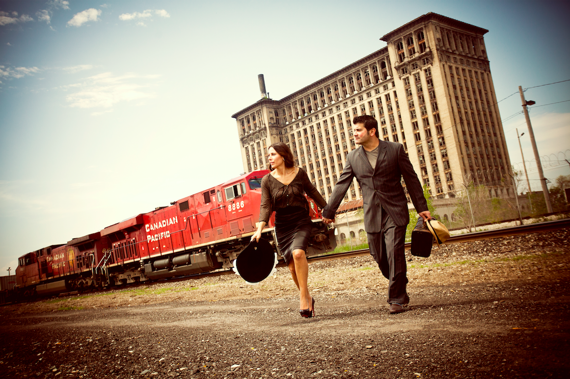 This image is by far our favorite engagement photo ever! Doesn’t get better than a Bonnie & Clyde theme! #trainstation!