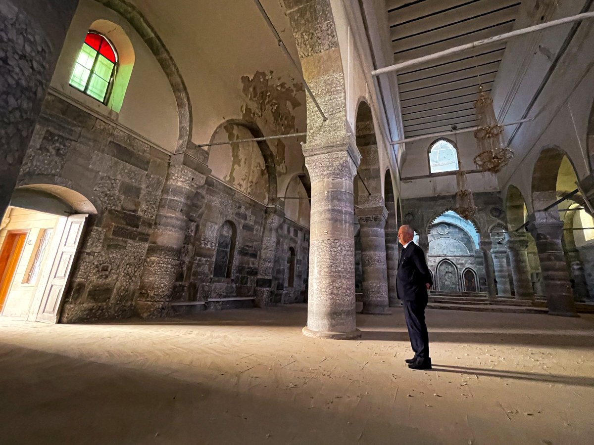Tilkepe Mayor Mr. Basim Balu reflects on the ruins, remembering the glory of The Sacred Heart Church. This holy place bonded many Tilkepe families for a century. This house of God was once resplendent in fine marble and mosaics. Now, blemished with