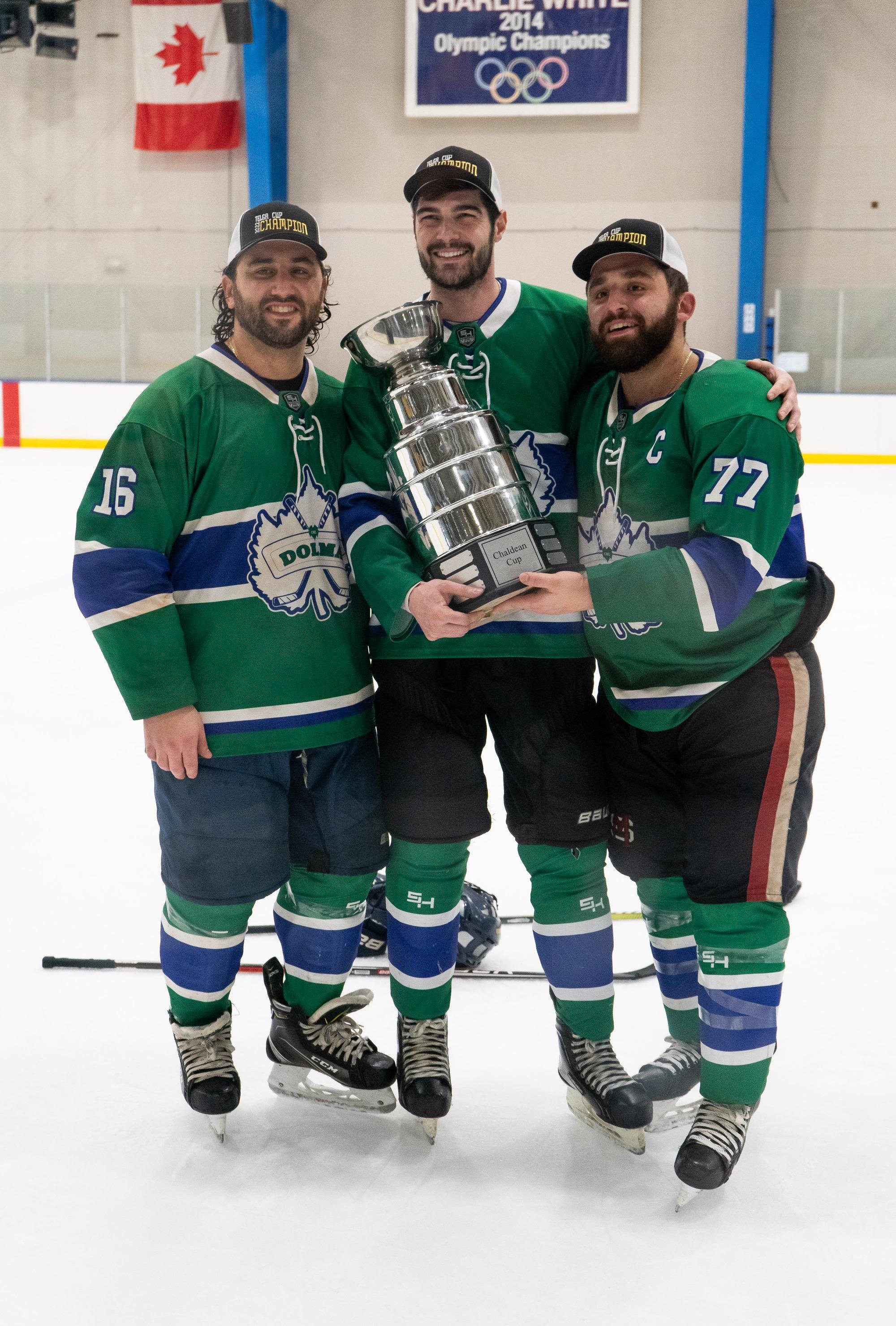  Brian Kassa (left), PJ Jonna and Kyle Kassa from Chaldean Hockey League playoff champion Team Green hold the coveted Telga Cup. 