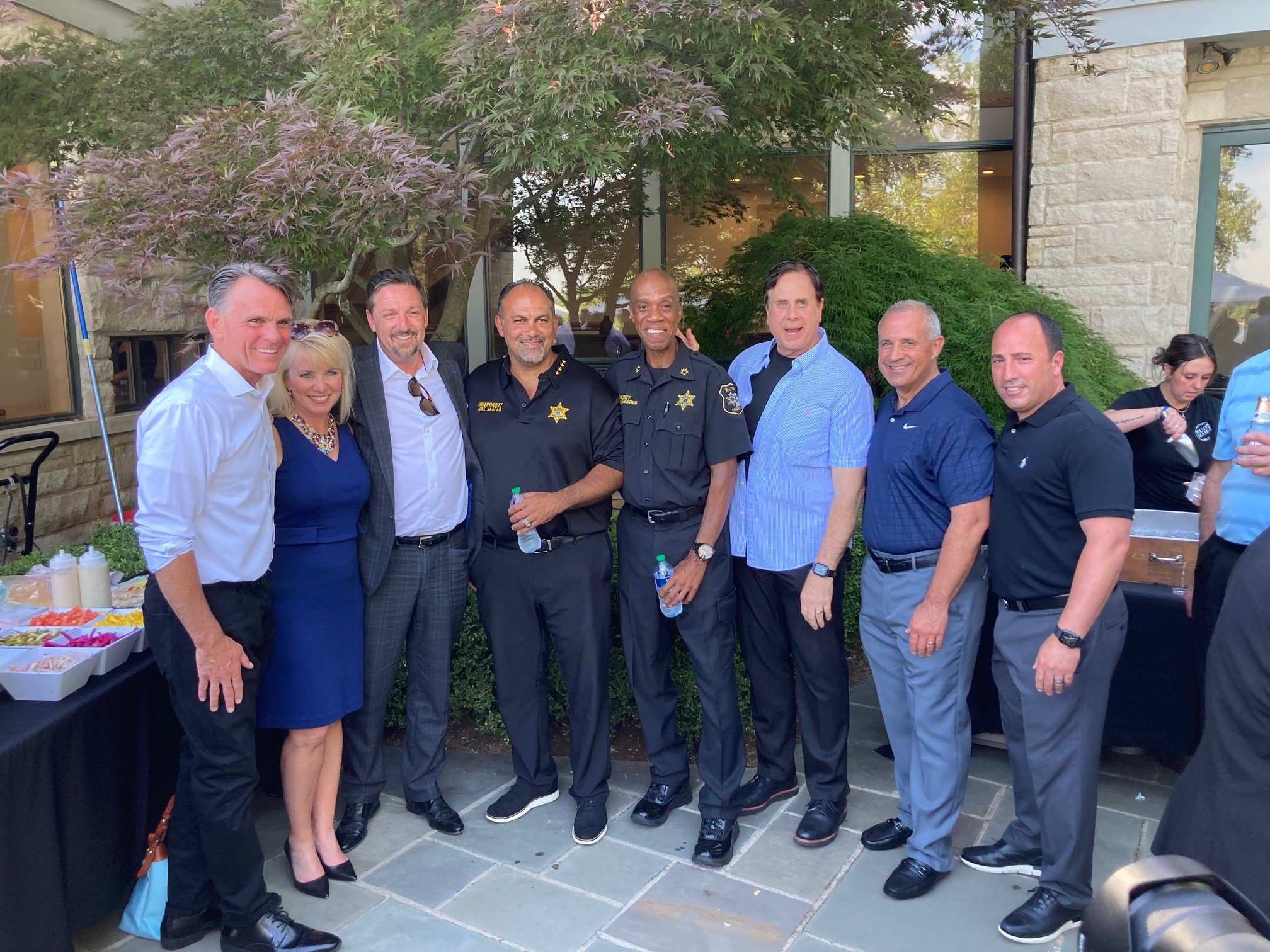 Lining up for a photo op, Left to right: Macomb County Executive Mark Hackel, Catherine Kochanski and Ken Gutman from Walled Lake Consolidated Schools, Wayne County Undersheriff Mike Jafaar and Wayne County Sheriff Raphael “Ray” Washington, Oakland 