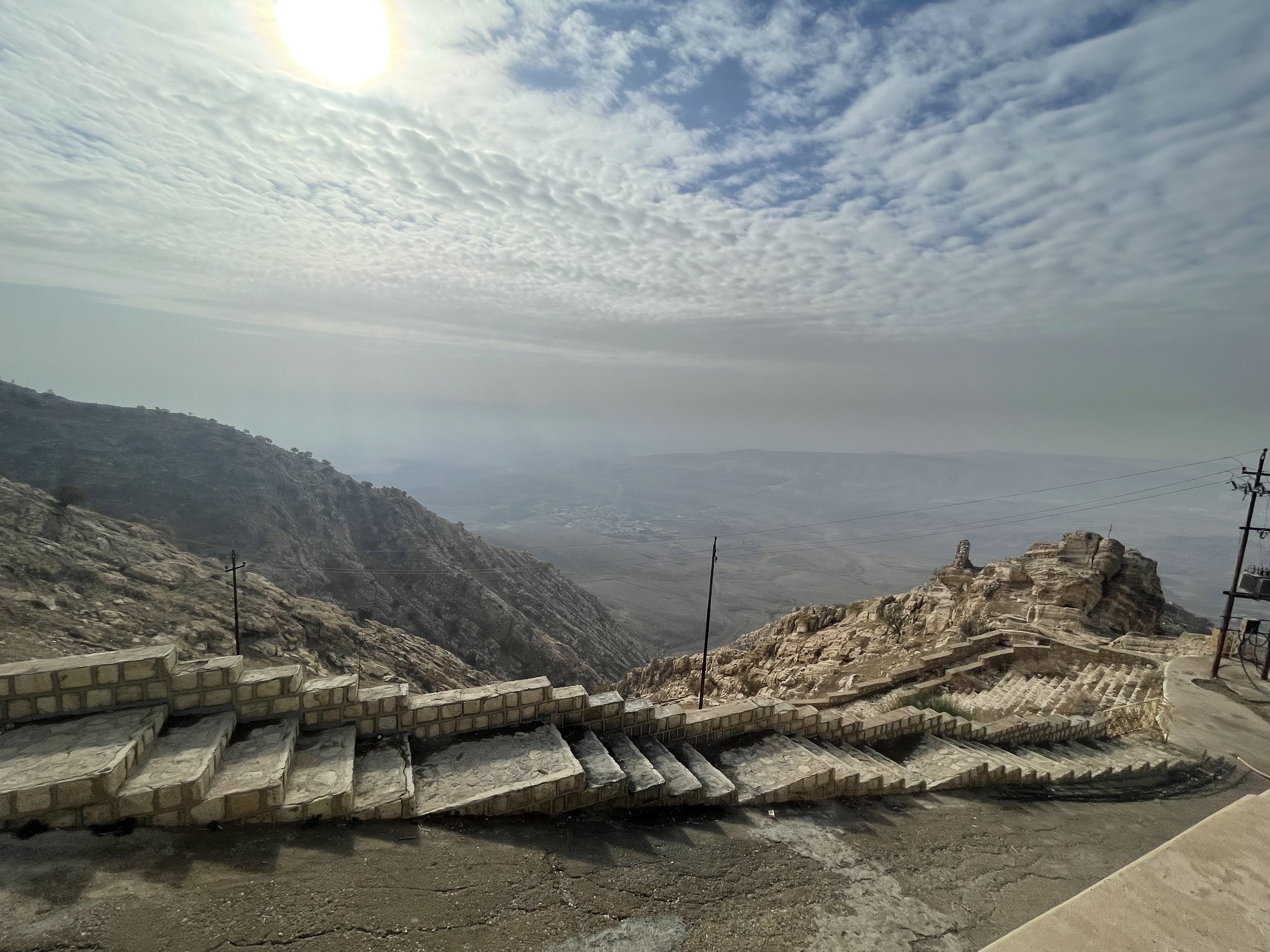  Seated on the shelf of a rocky peak, the monastery offers an exceptional double view. As seen from the valley, it appears as being suspended between the earth and the sky and leads us to meditation. On the other side, from its terrace, it offers a 1