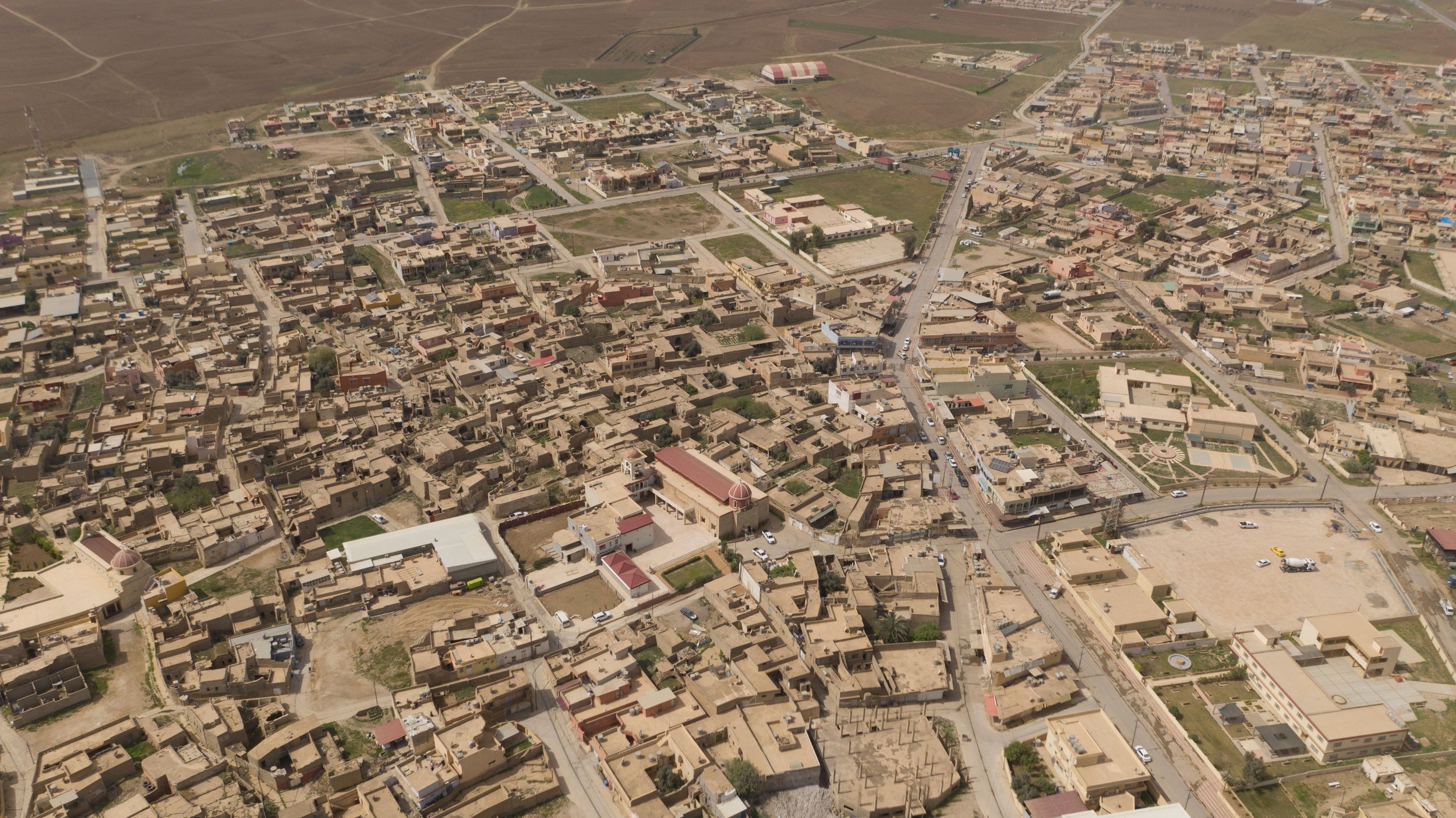 An aerial shot of Tesqopa. In the early part of the millennium, it received many refugees from Baghdad and Mosul who were caught up in the wake of conflict. Tesqopa was the target of ISIS in 2014 but the Kurdish Peshmerga retook the village shortly