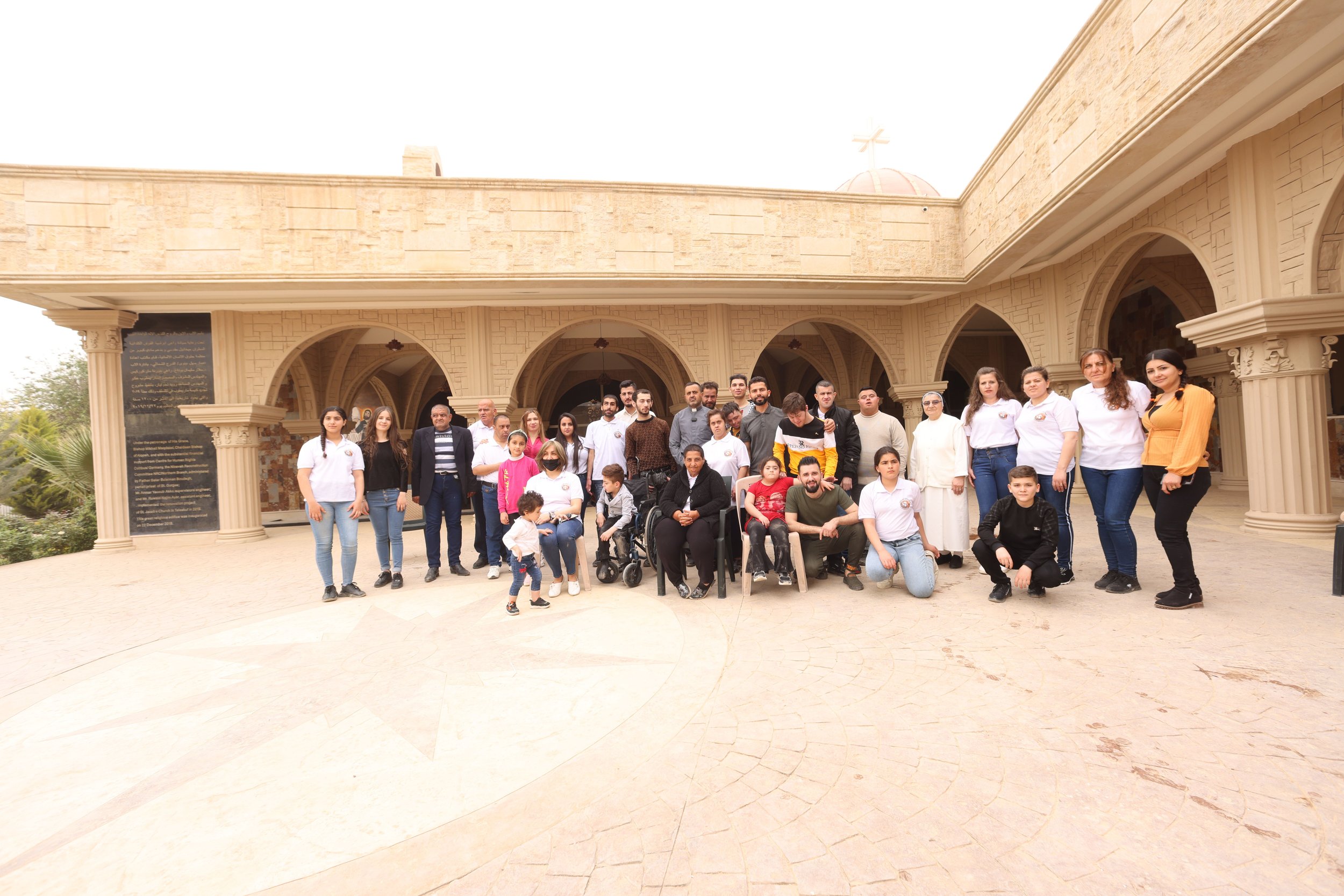  Parishioners of Mar Yaqo pose outside the church for a photo. They were gathering at the church to prepare for Easter celebrations. Iraqi officials have made efforts to secure churches since the violence of a 2010 attack on Our Lady of Salvation in 