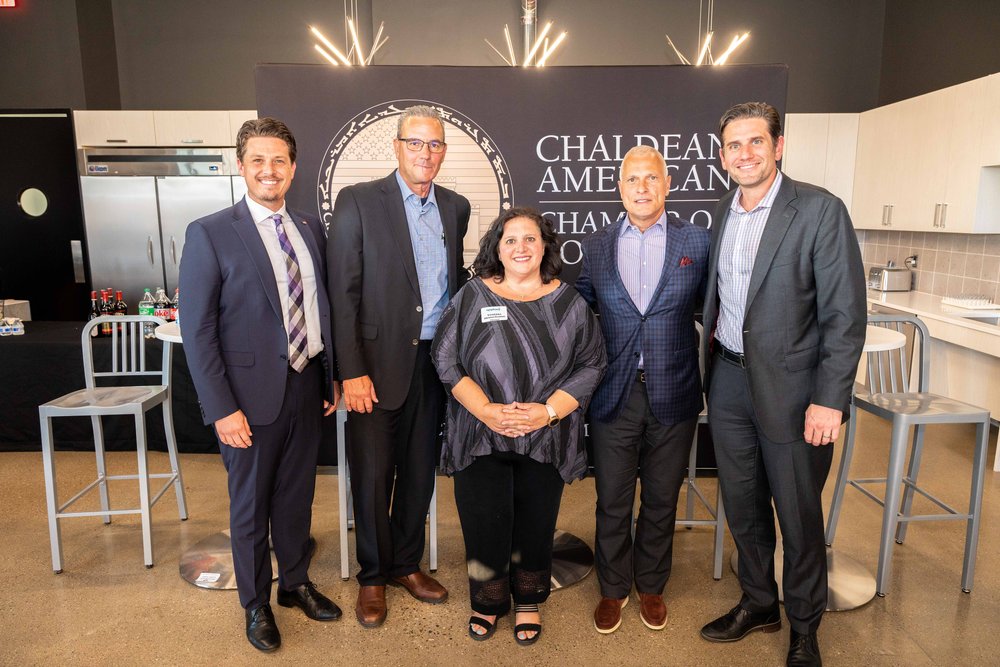  From left to right: Mayor Ethan Baker (Troy), Supervisor Larry Gray (Commerce), Vanessa Denha Garmo, CEO Eric Larson (DDP), and Mayor Michael Taylor (Sterling Heights). 