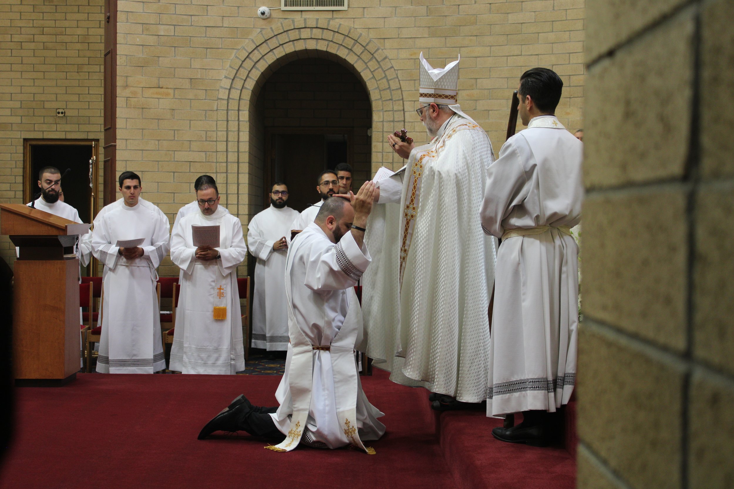 Bishop Francis laying hands on Fr. Namir Narra. 