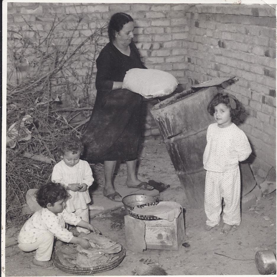  Hanah and granchildren making bread. 