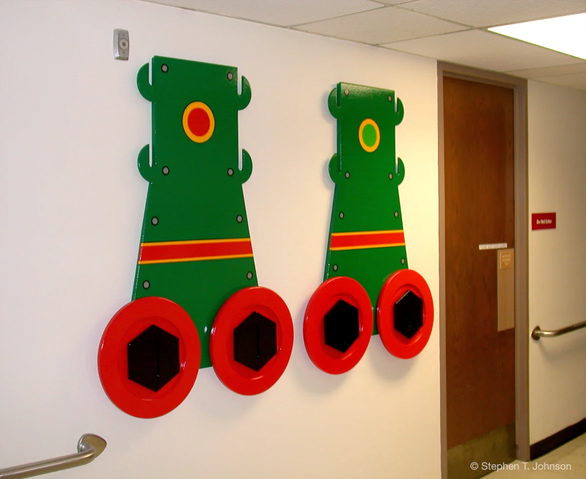 Robot Legs with rotating red circles and rotating black hexagons.