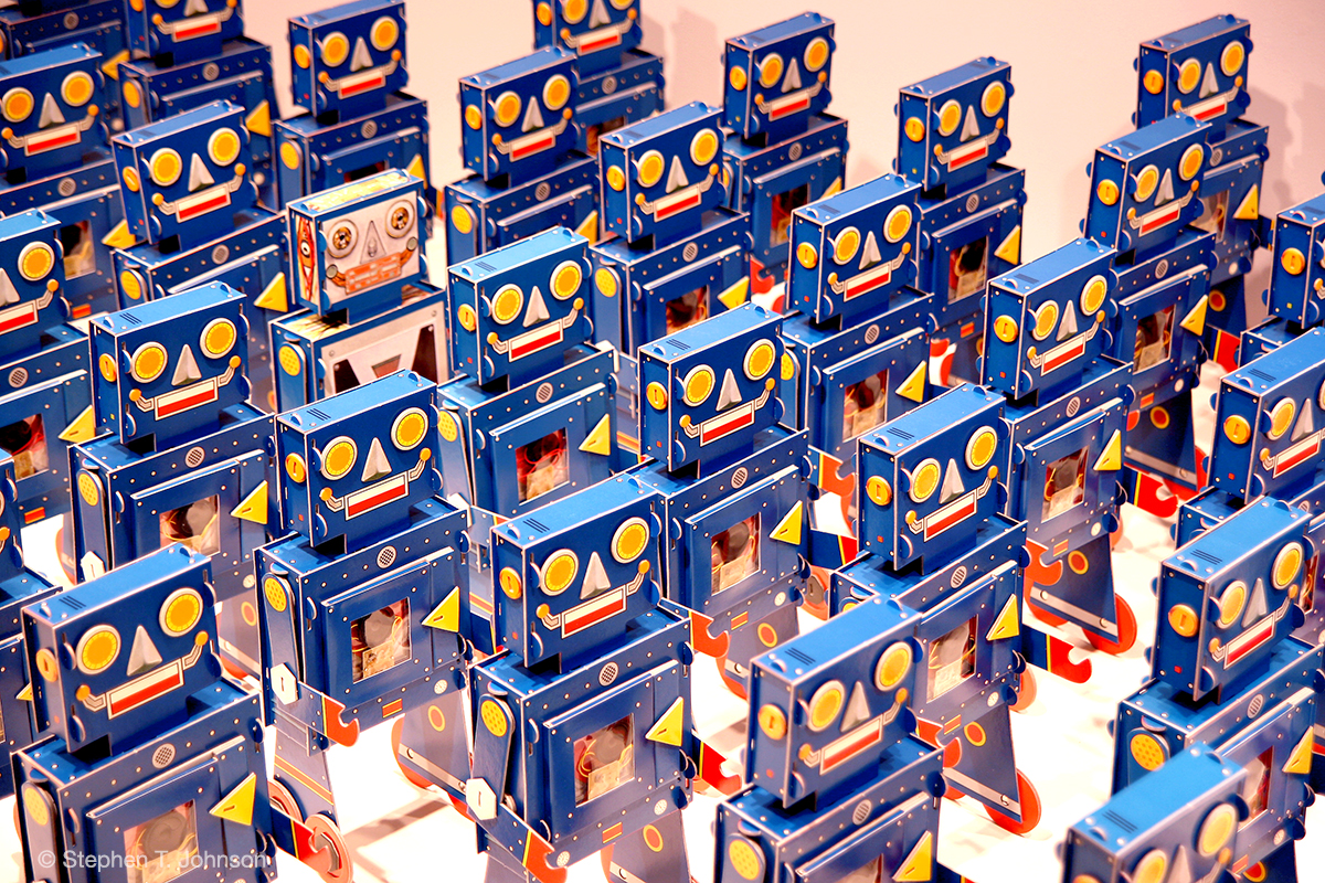 100 robots from STJ's children's book My Little Blue Robot published by Simon & Schuster, NYC, exhibited at the Mulvane Museum of Art, Washburn University, Topeka Kansas, 2010. (Look for the single Robot that was built inside out...)