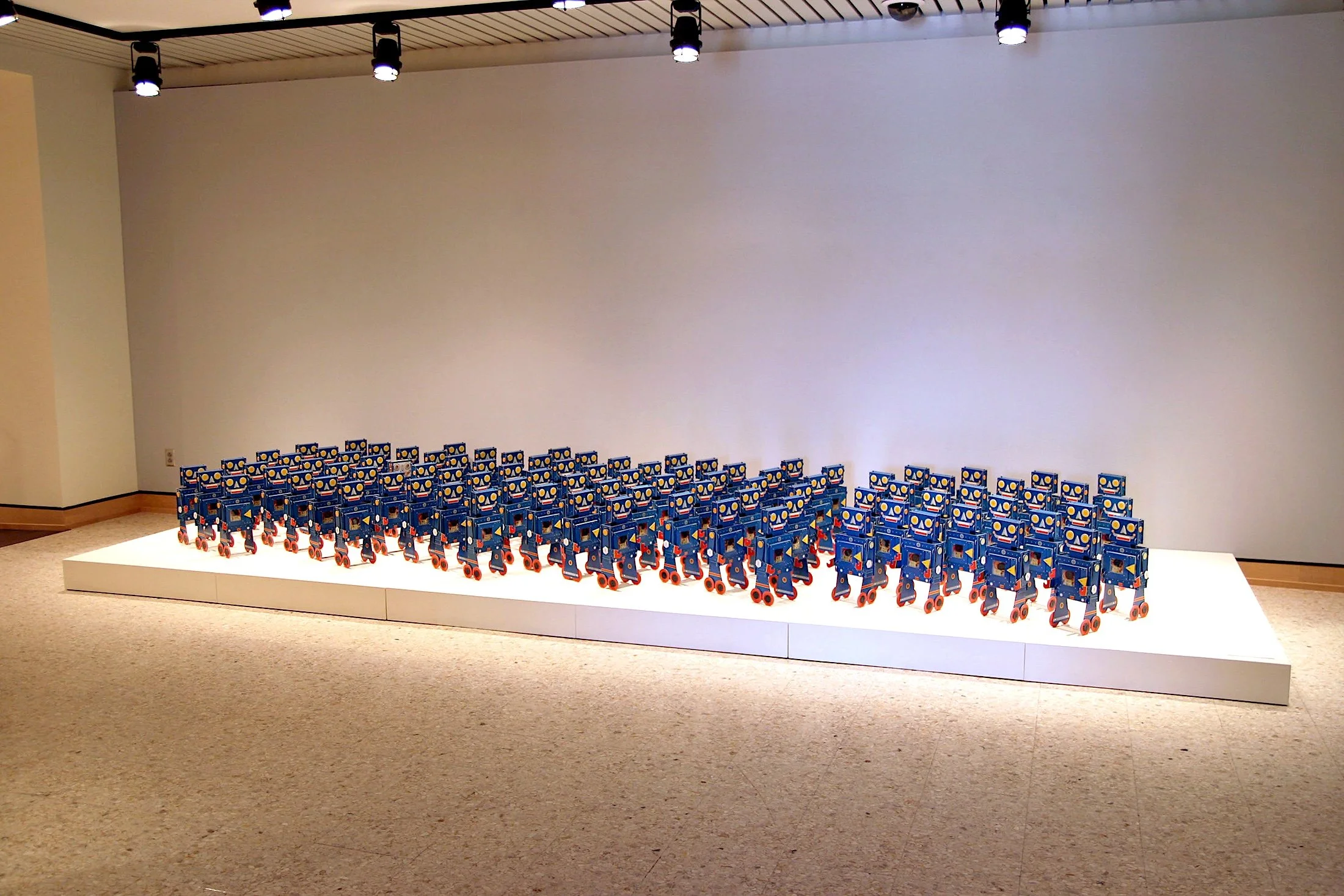   Representatives , 100 constructed robots, 2010. Installation view from  Language, Content and the Alphabet , Mulvane Art Museum. 