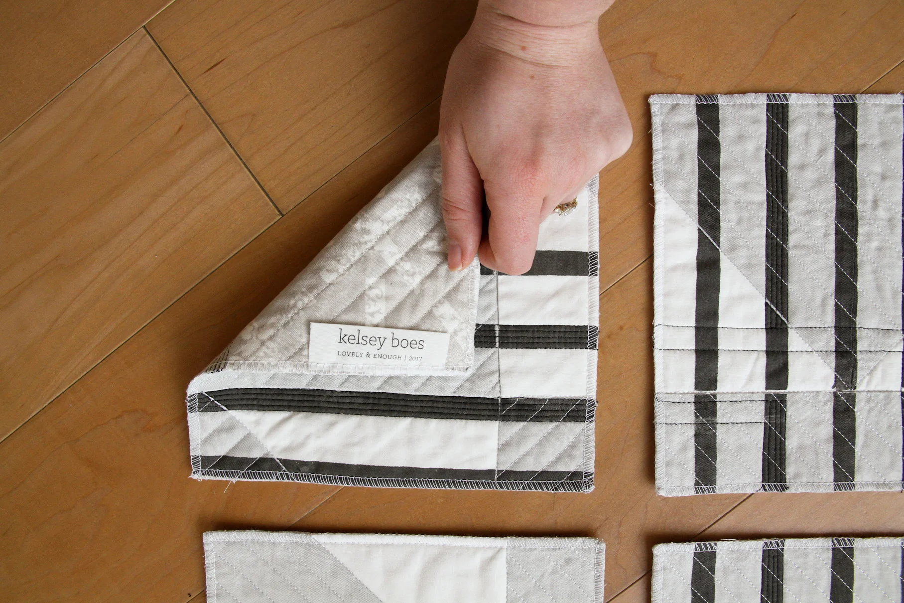 deconstructed and printed black and white modern quilt with DIY professional label