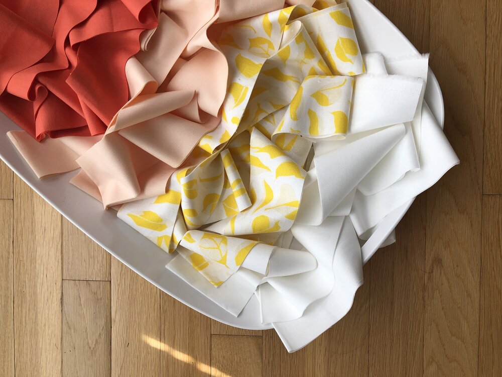 modern strip quilting in bright coral, peach, citron | Lovley and Enough