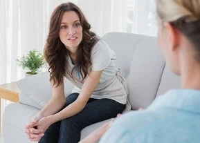 young-woman-listens-to-counselor.jpg