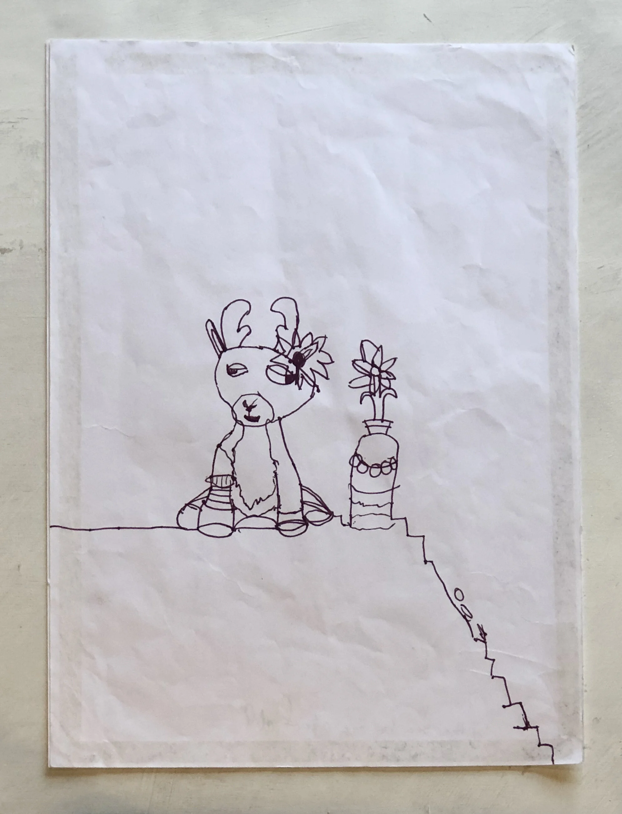  By Suzanna Wong, age 8. She set her soft toy reindeer on her desk, decorated it with fancy hair clips and jewels, then drew and quoted "It's enjoying a seaside view on the edge of a cliff”. 