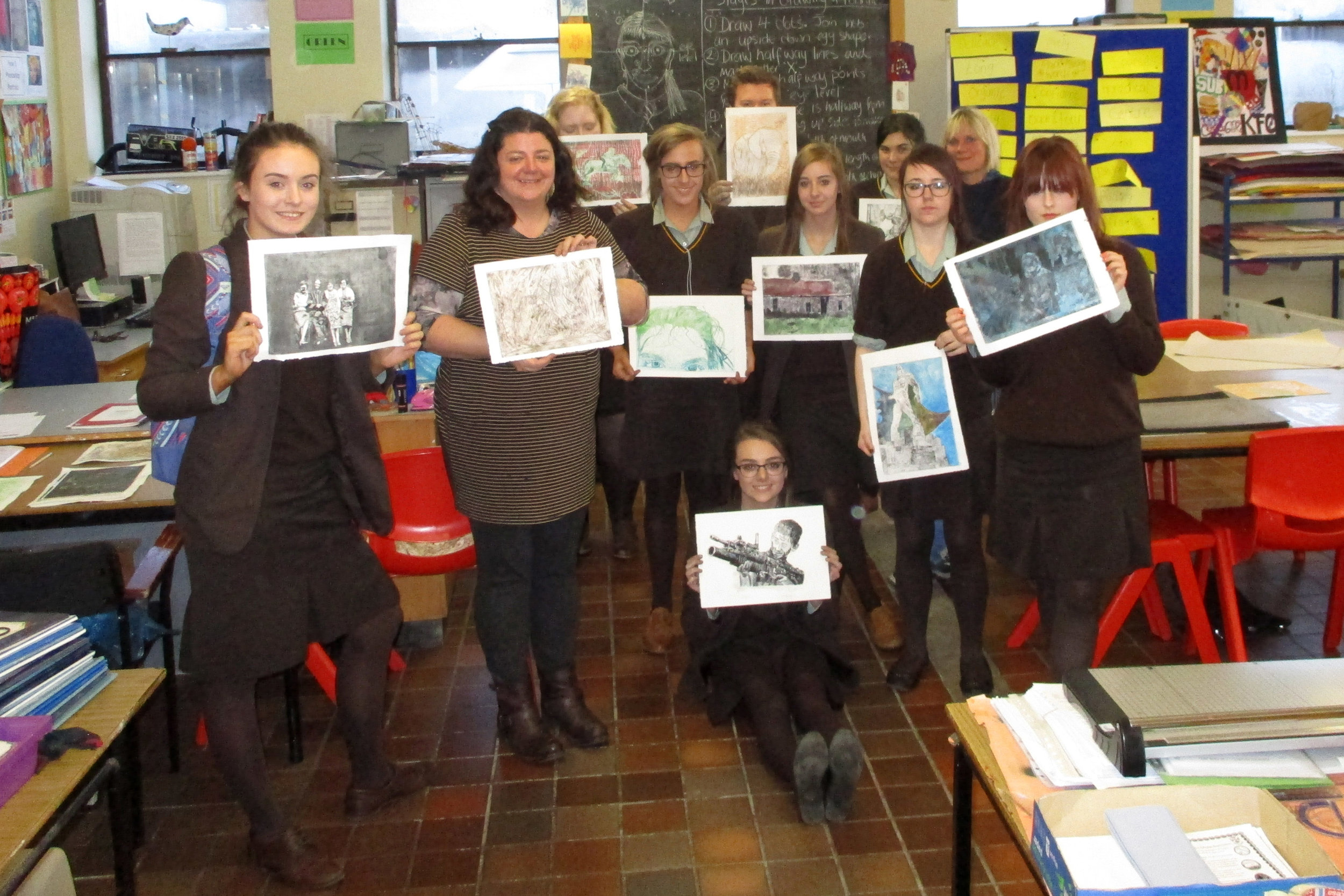 Art teacher Mrs Uprichard is pictured below with the pupils and their prints