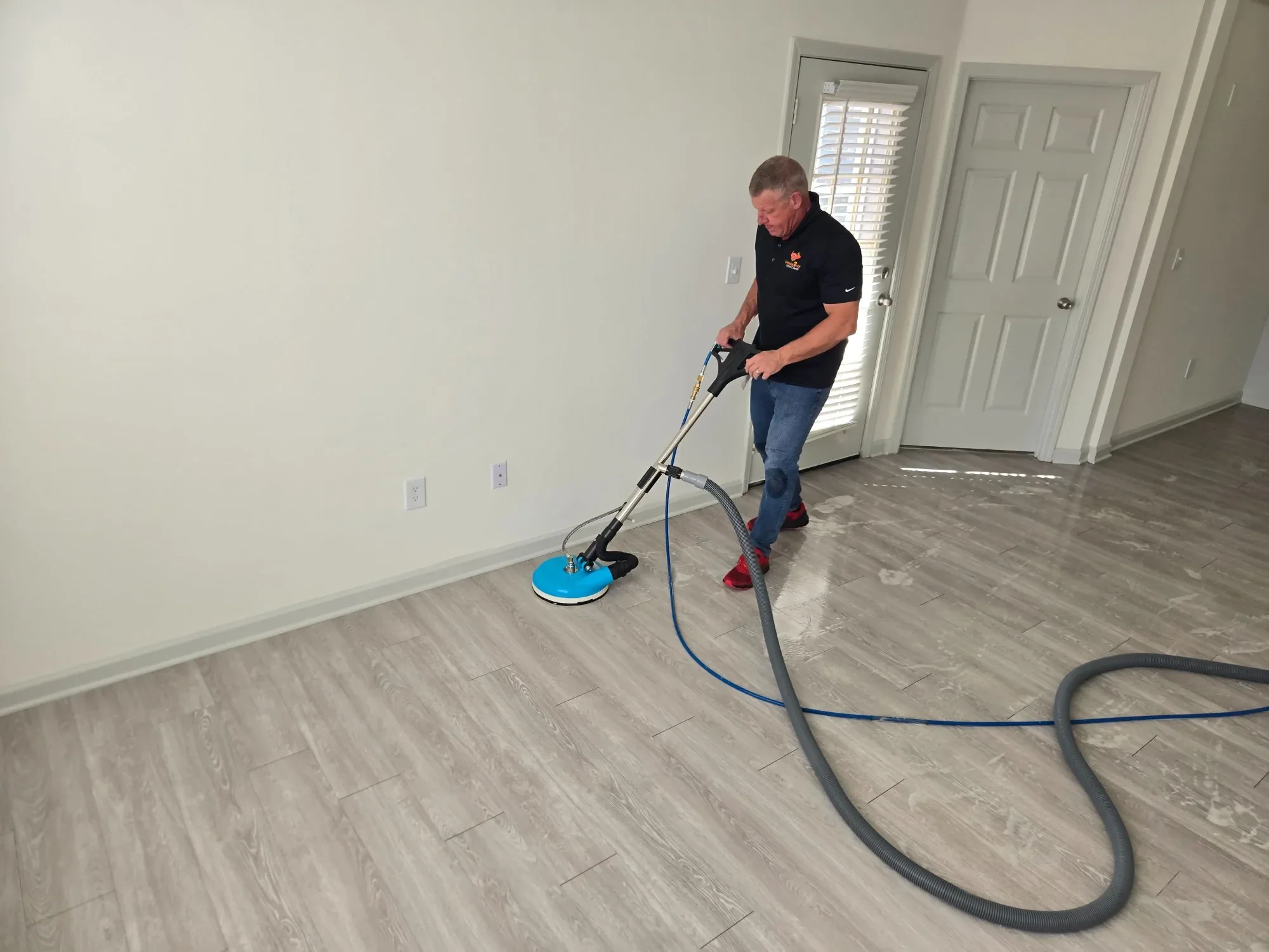 CitruSolution technician cleaning LVP floors in a Marietta GA home