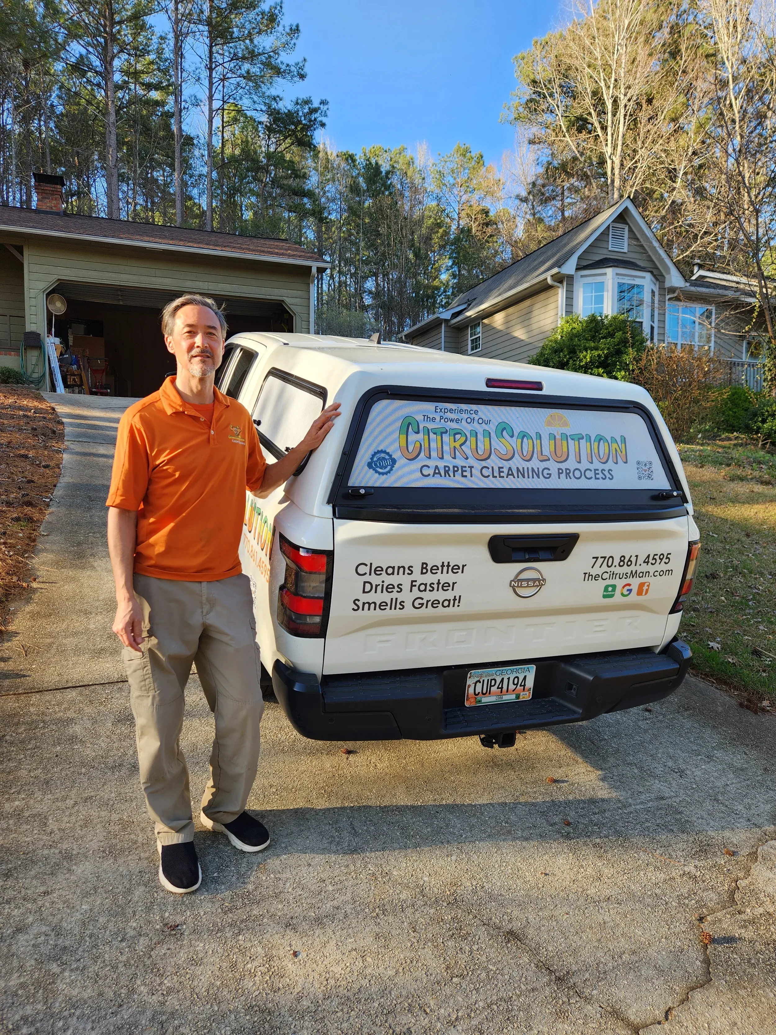 Rob, owner of CitruSolution West Cobb carpet cleaning, with his branded service truck in Marietta GA