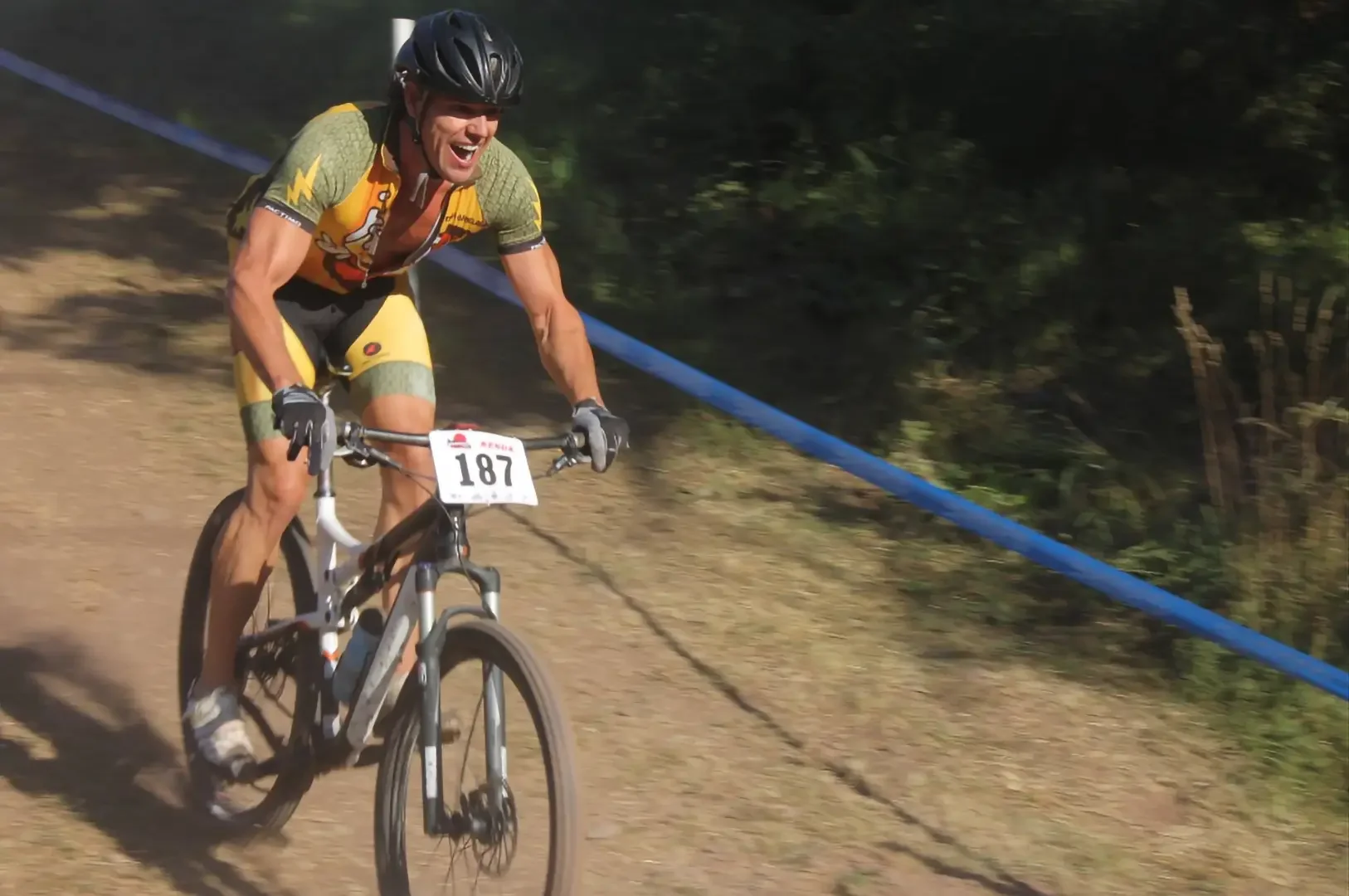 Corey Carthew professional voiceover artist mountain biking with joy of little kid.