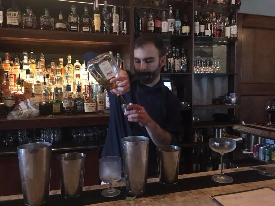Enjoying a drink at Bouligny Tavern in New Orleans.