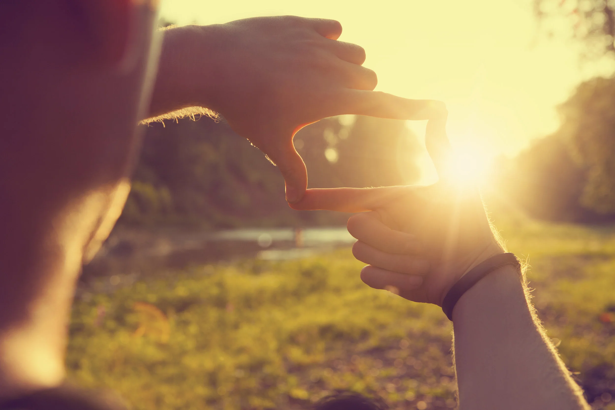 Hands-framing-distant-sun-rays-493515262_5616x3744.jpeg