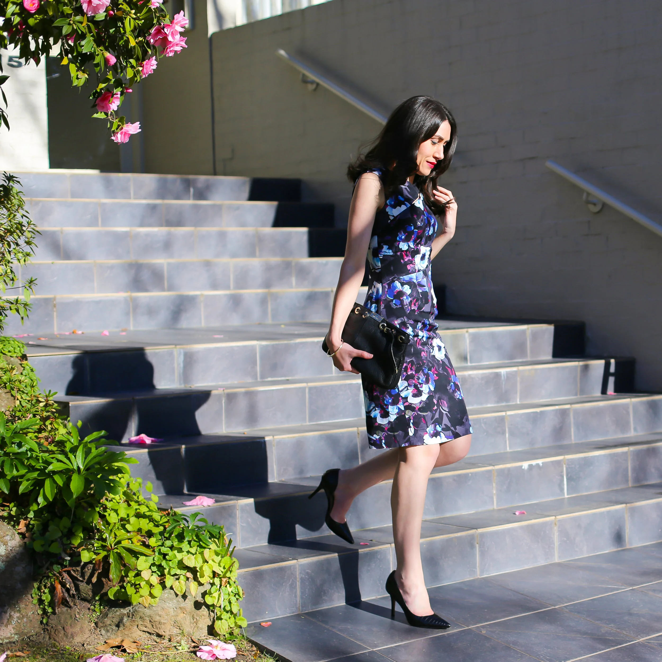 Lisa wears David Lawrence Lotus Print Dress & Jimmy Choo Clutch